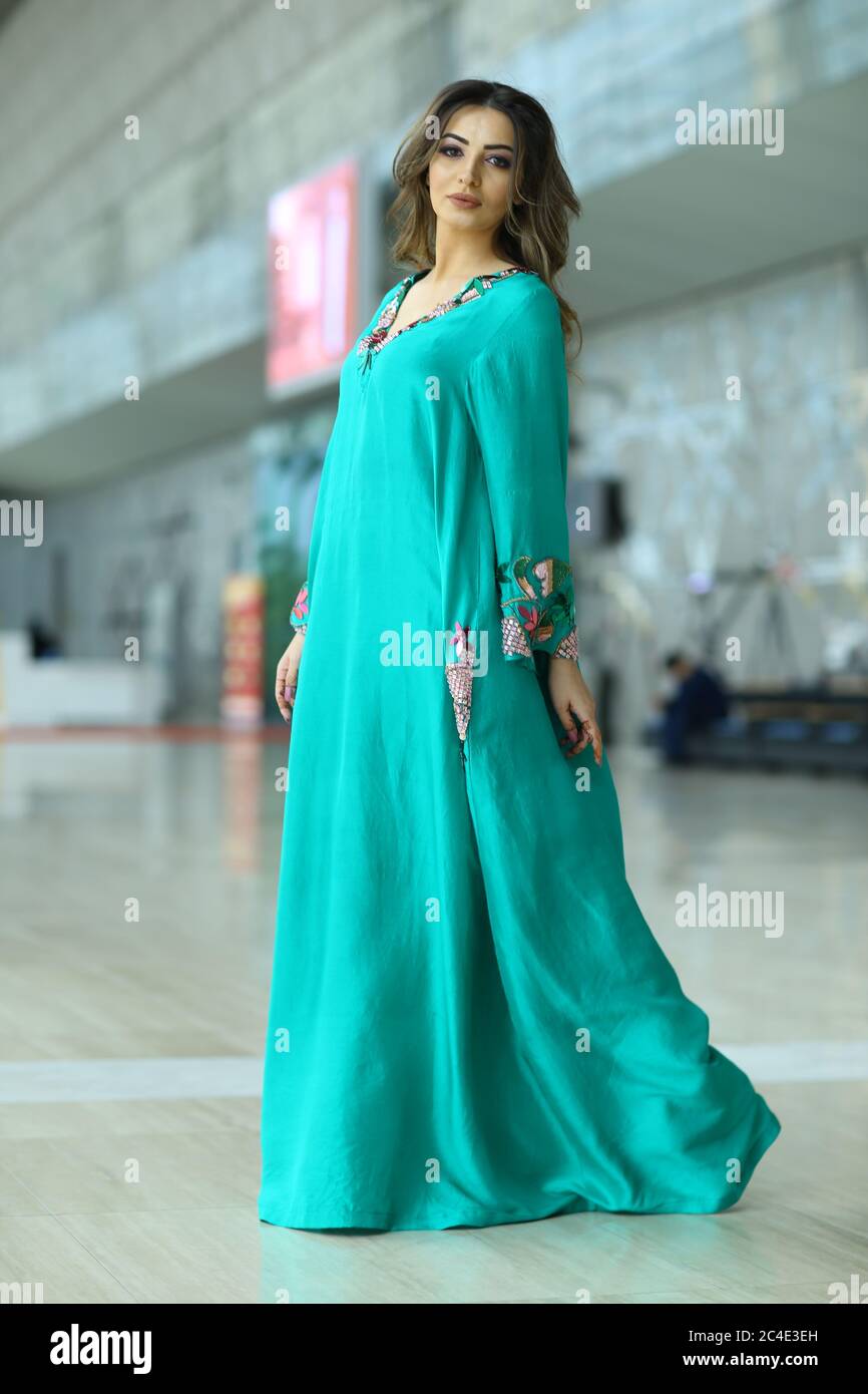 Arab Women in Turquoise Traditional Dress Stock Photo - Alamy