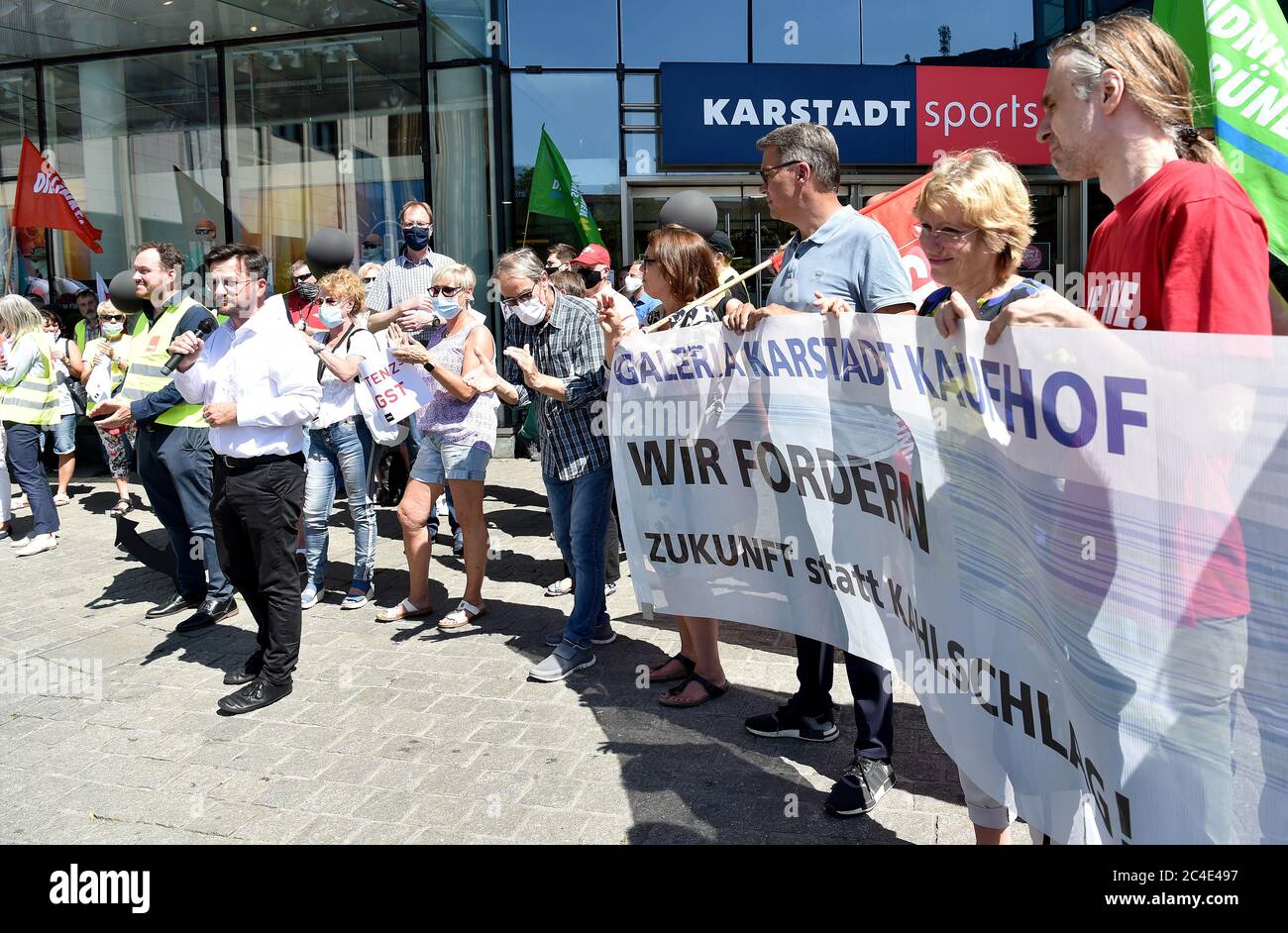 26 June 2020, North Rhine-Westphalia, Dortmund: Thomas Kutschaty (SPD, l), Chairman of the SPD faction in the state parliament and works council members of Galeria Karstadt Kaufhof and Karstadt Sports demonstrate to the Karstadt Sports shop in the city centre. The ailing department store group had announced the closure of 62 of its 172 department stores last week. The company headquarters in Essen and the city of Dortmund have been hit particularly hard. In both cities, the remaining two department stores are to be closed. Photo: Caroline Seidel/dpa Stock Photo