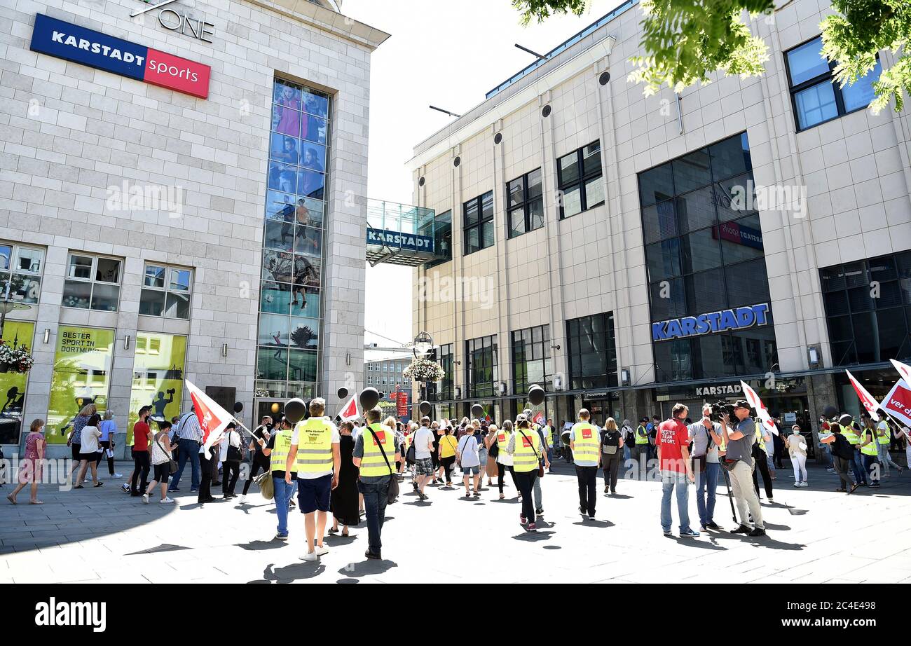 26 June 2020, North Rhine-Westphalia, Dortmund: Works council members of Galeria Karstadt Kaufhof and Karstadt Sports demonstrate in front of one of the two stores (r) and the Karstadt Sports (l) store in the city centre. The ailing department store group had announced the closure of 62 of its 172 department stores last week. The company's headquarters in Essen and the city of Dortmund have been hit particularly hard. In both cities, the remaining two department stores are to be closed. Photo: Caroline Seidel/dpa Stock Photo
