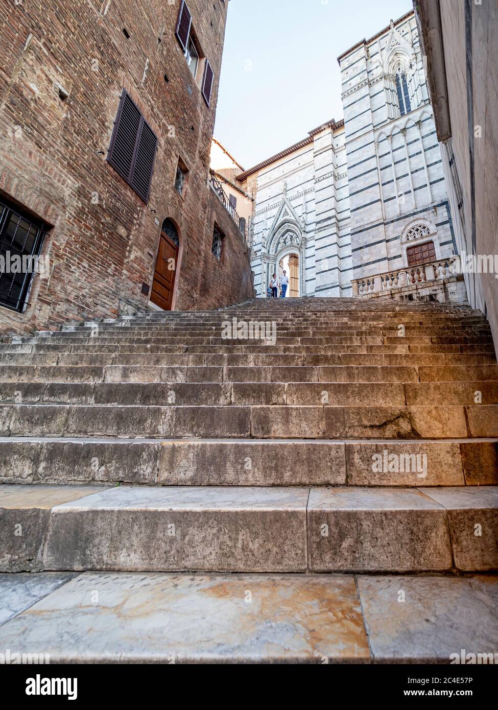 Marble steps from Piazza San Giovanni which lead to the Piazza del Duomo. Siena, Italy. Stock Photo