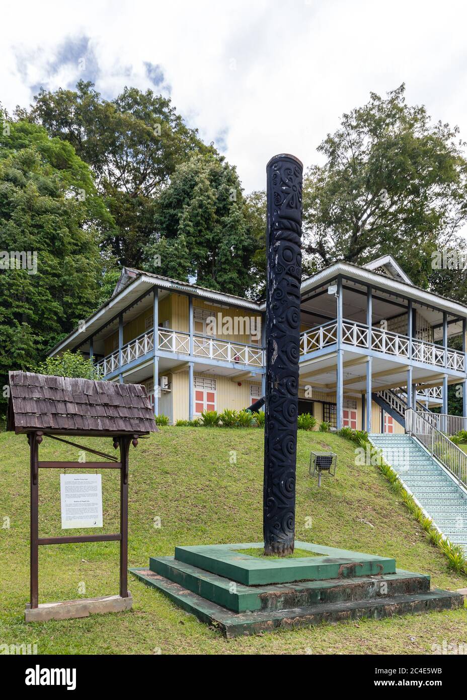 Limbang, Sarawak, Malaysia: Replica of the carved 'Pagul Pole' with gibbon motif in front of 'Limbang Regional Museum' Stock Photo
