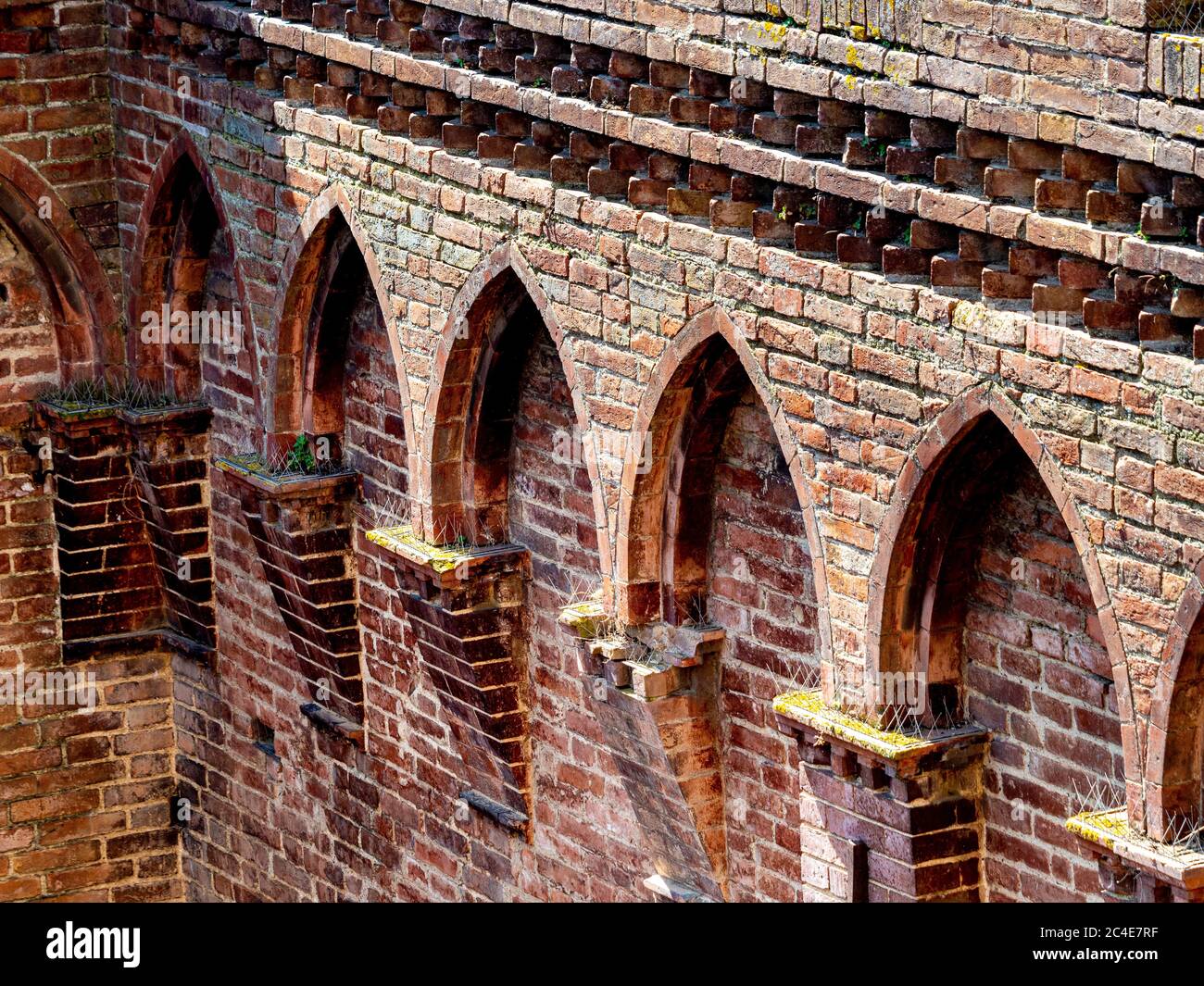 Close up of the brickwork on the Palazzo Pubblico seen from the Torre del mangia. Siena. Italy. Stock Photo