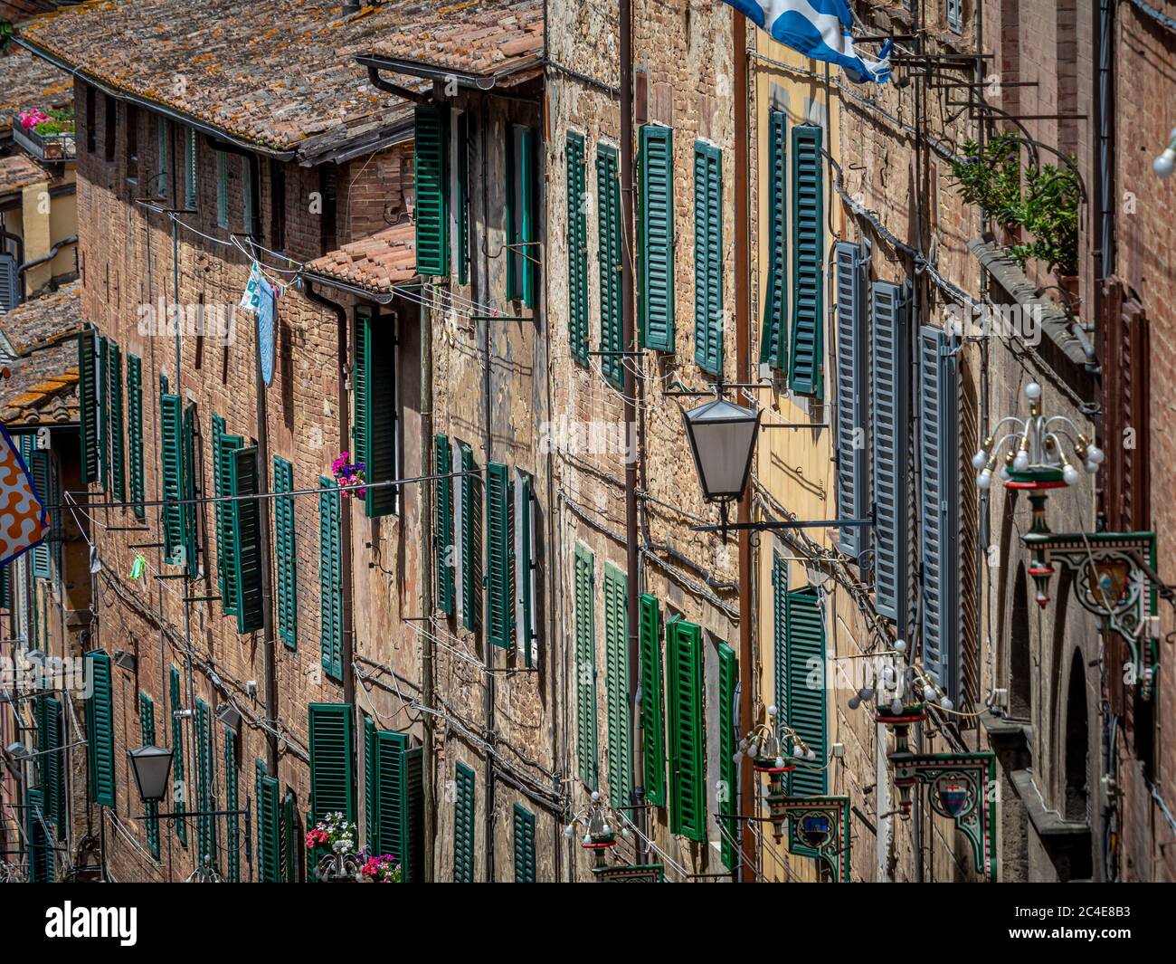 Traditional Siena houses with wooden window shutters. Siena. Italy. Stock Photo