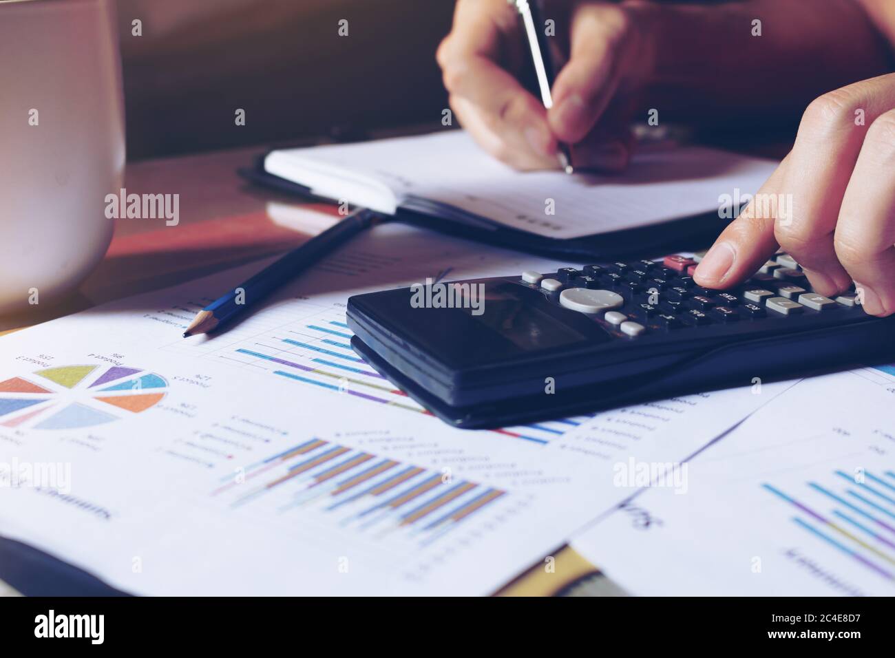 Woman making calculator working hi-res stock photography and images - Alamy