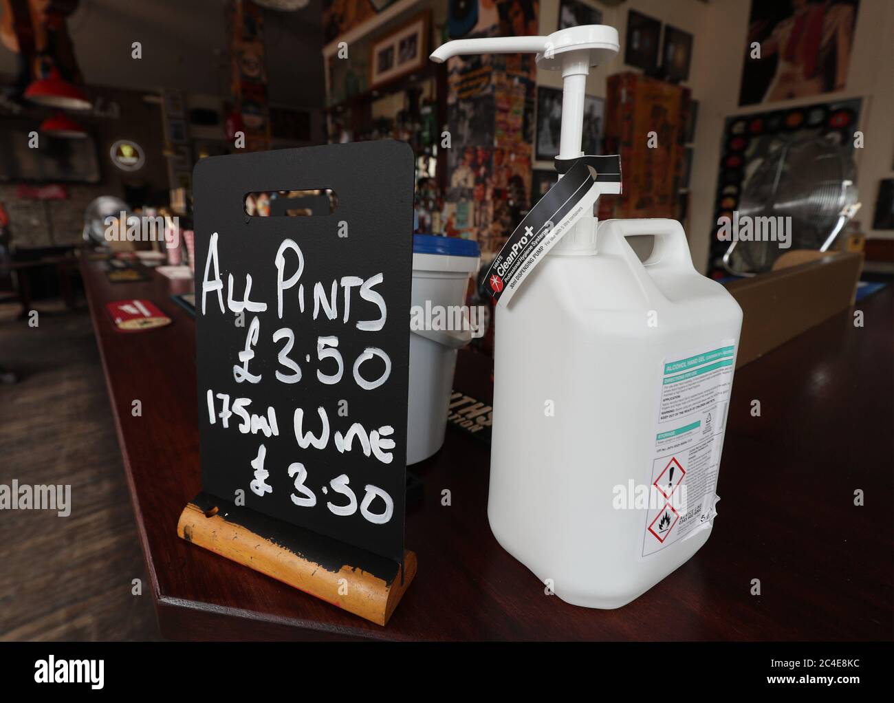 Alcohol hand gel provided for customers at the bar of Charrington's Noted Ales And Stout pub in London, as further coronavirus lockdown restrictions are lifted in England. Stock Photo