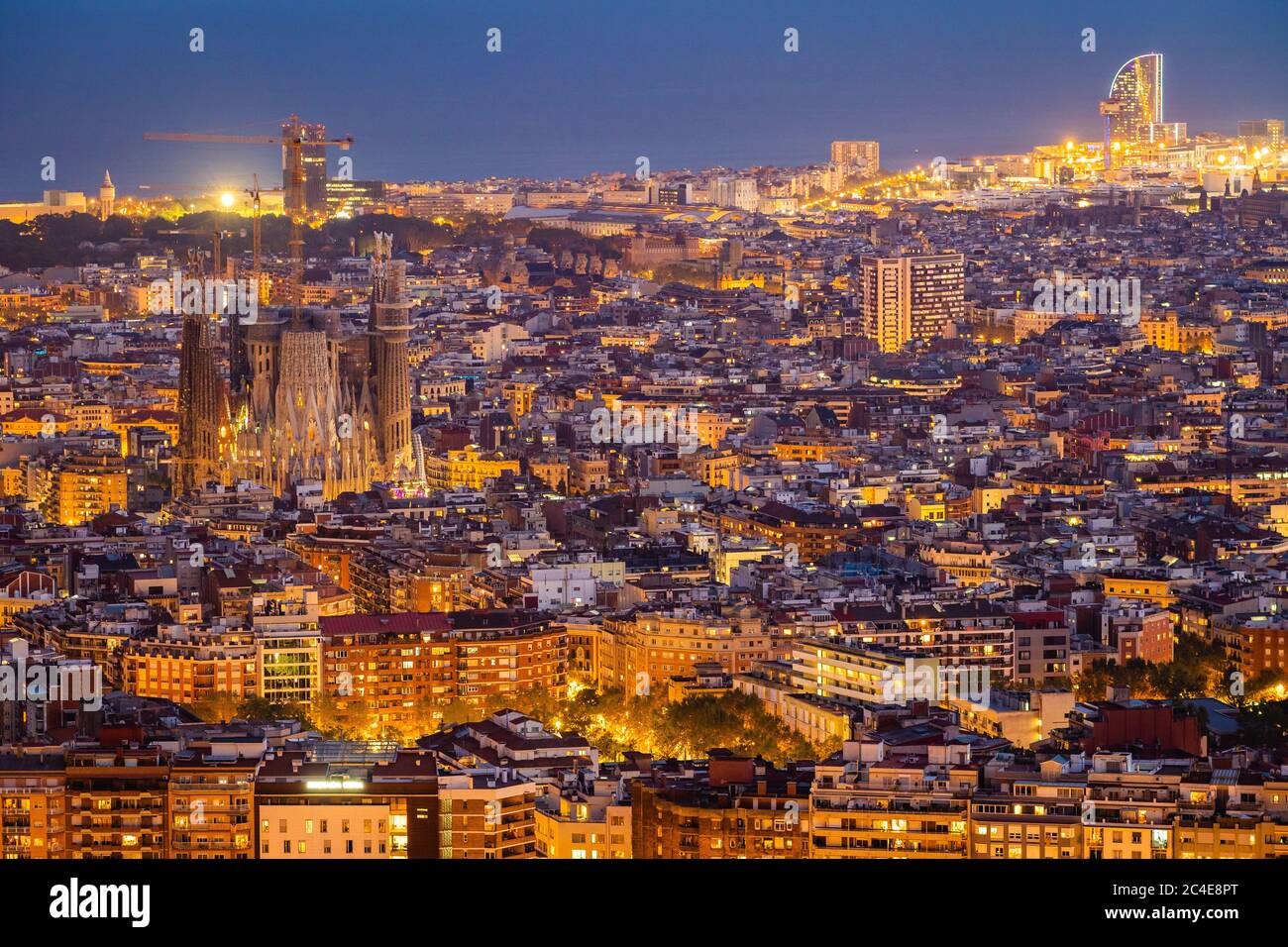 Aerial view of Barcelona cityscape including architectural landmark Sagrada Familia basilica