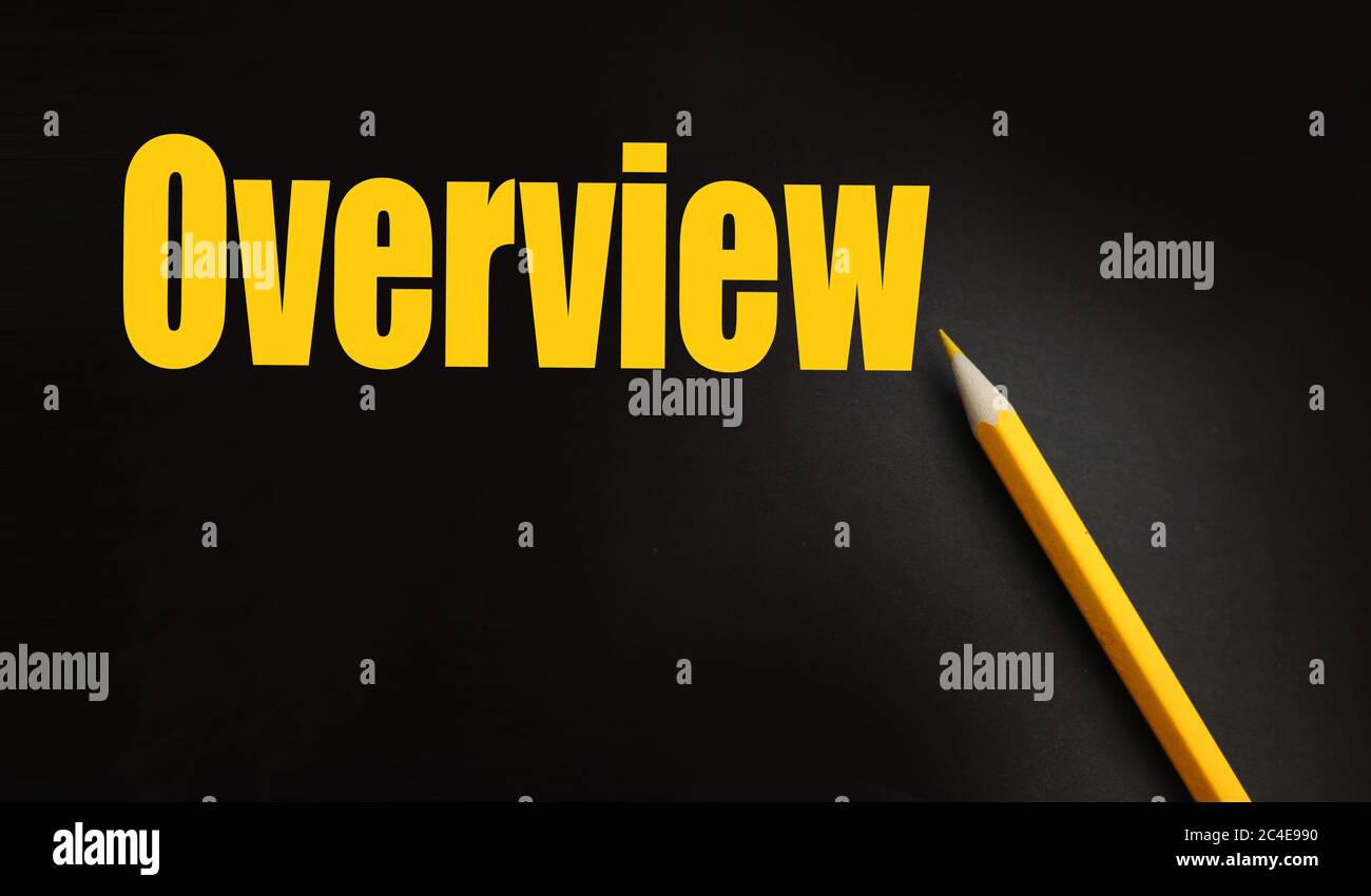 OVERVIEW word printed in yellow ink on black paper and pencil besides
