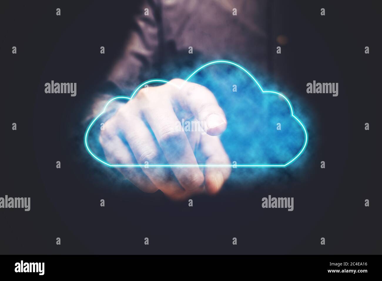 Businessman pressing cloud computing icon with vitual screen. Stock Photo