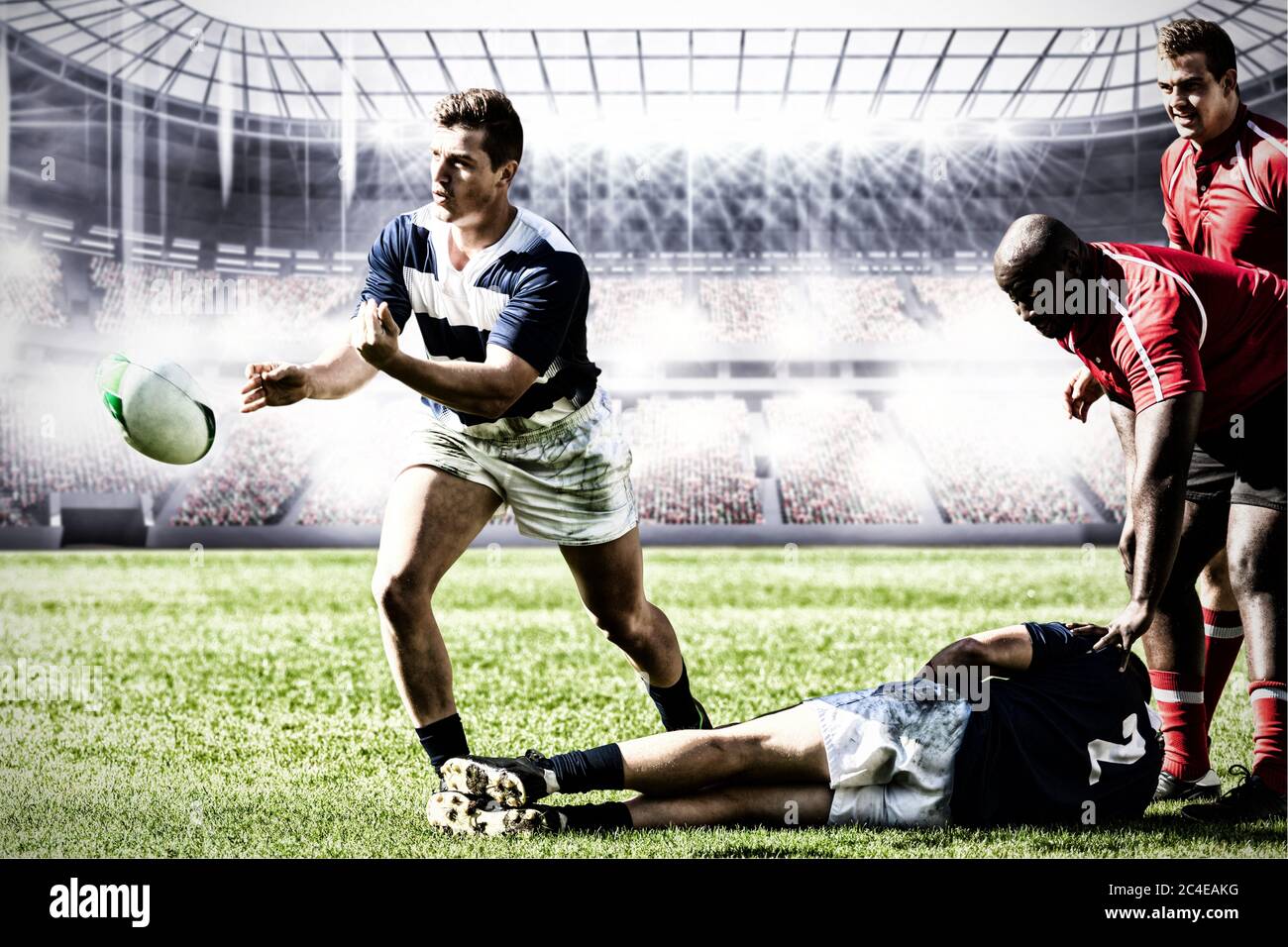 Digital composite image of team of rugby players playing rugby in sports stadium Stock Photo