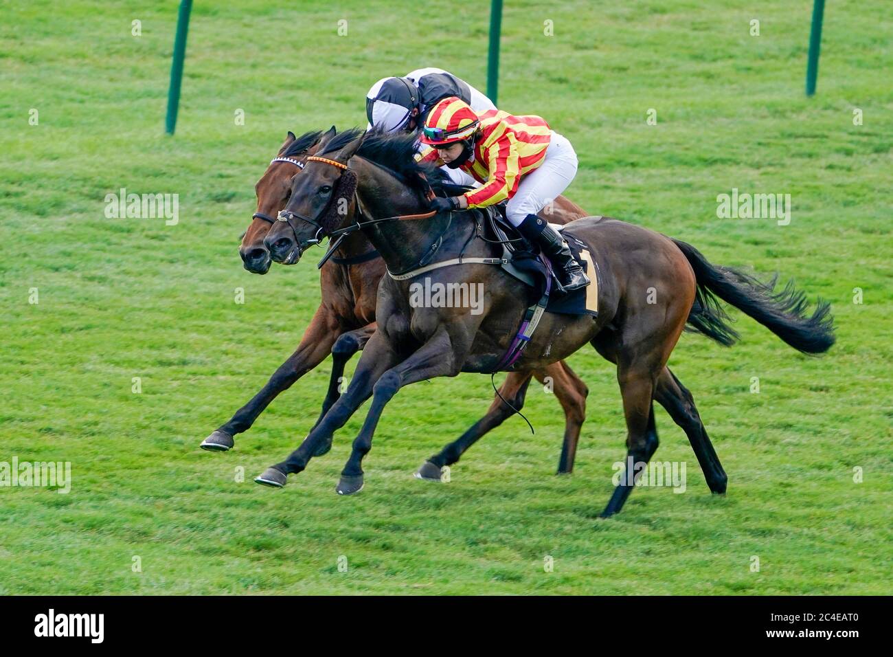 Wimpole Hall ridden by Gaia Boni (right) wins The Play 4 To Score At Betway Handicap from Songkran and William Buick at Newmarket Racecourse. Stock Photo