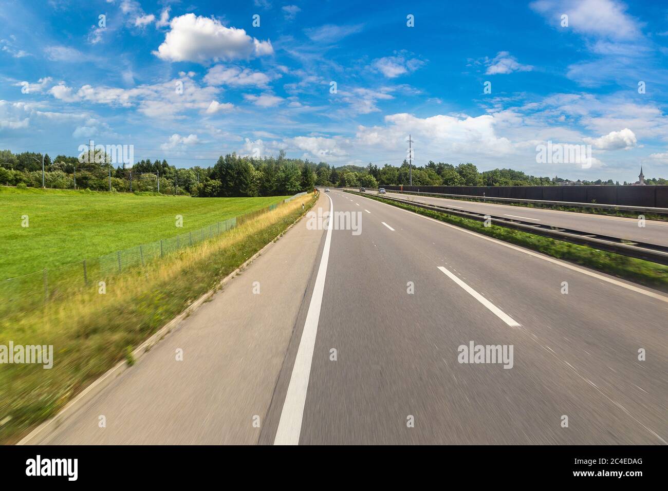 Asphalt road in Switzerland in a beautiful summer day Stock Photo - Alamy