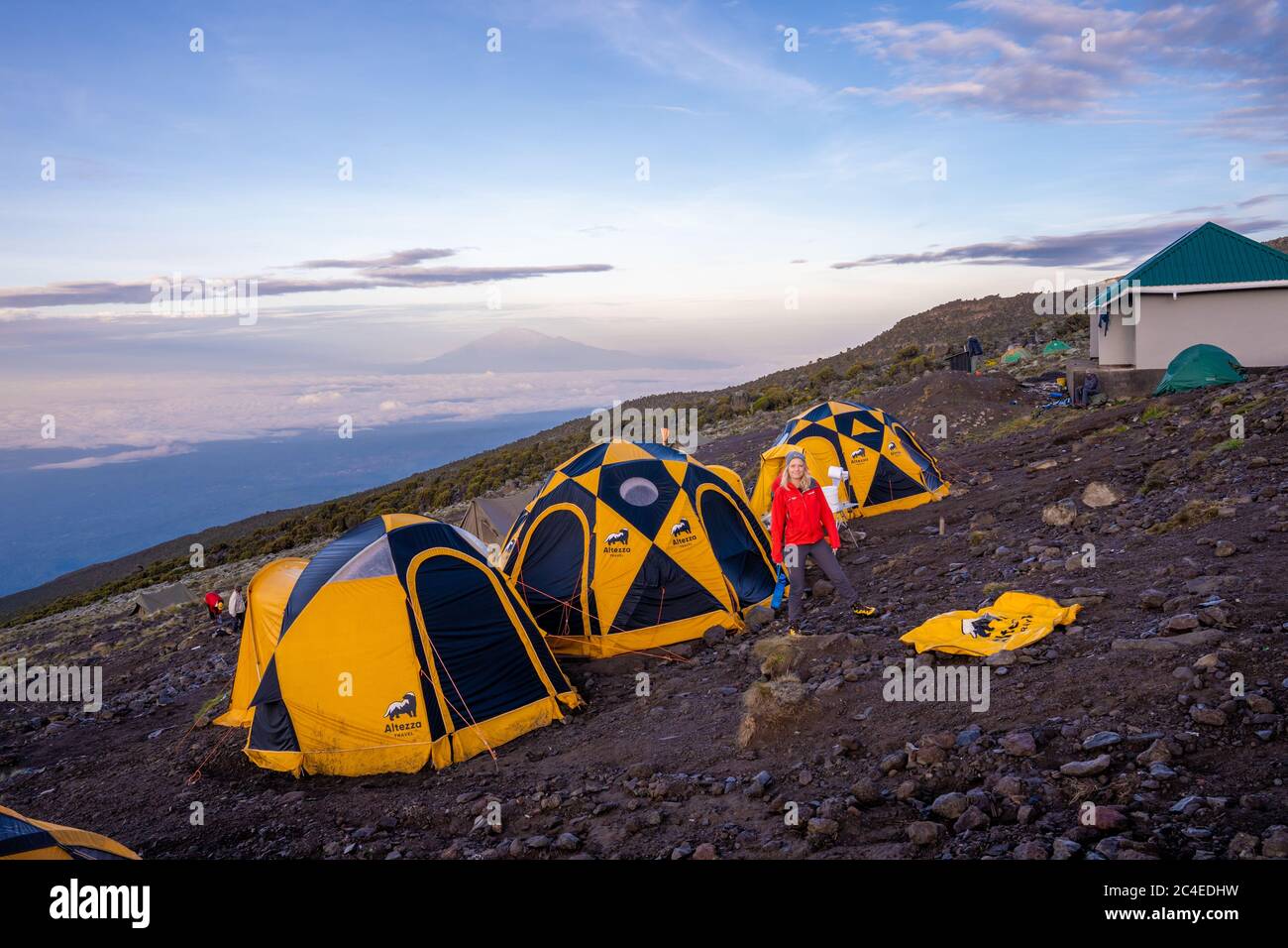 Beautiful scenery of yellow tents in the Kilimanjaro National Park ...