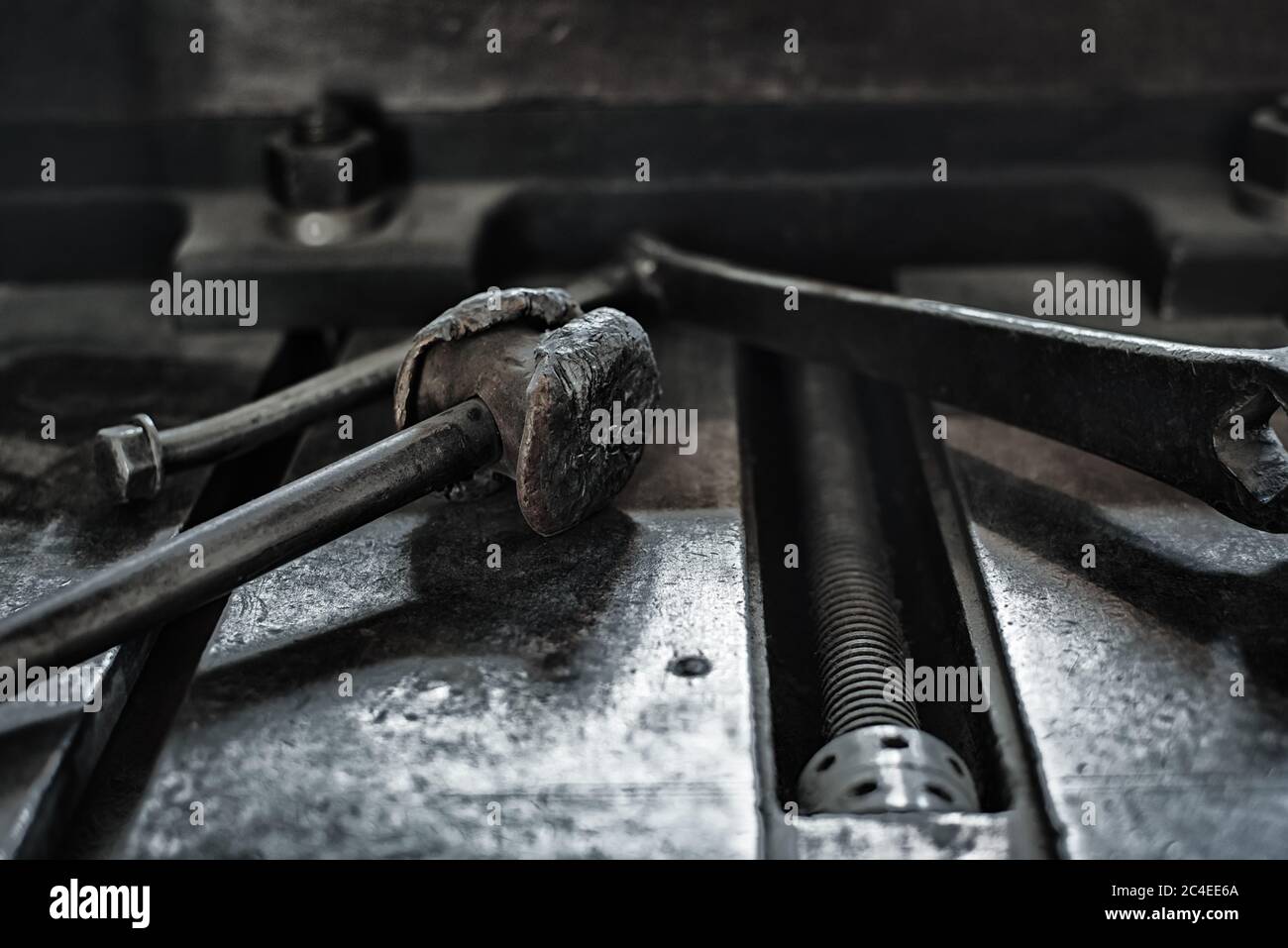 Vintage old metallic tools laying on a iron table surface Stock Photo