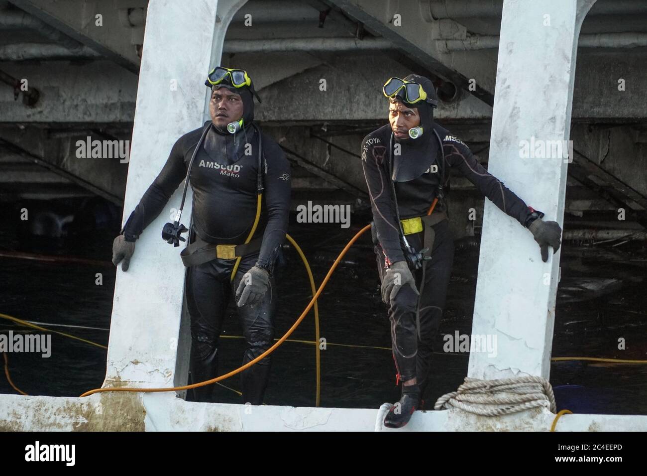 Karangasem, Bali, Indonesia. 26th June, 2020. Two divers standing on ...