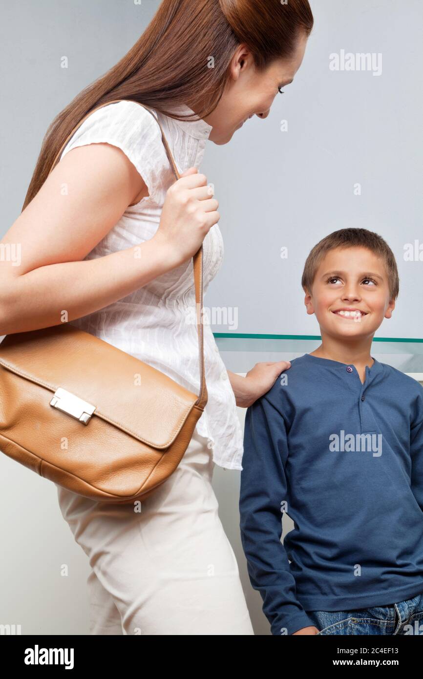 Mother with her smiling son on the office Stock Photo