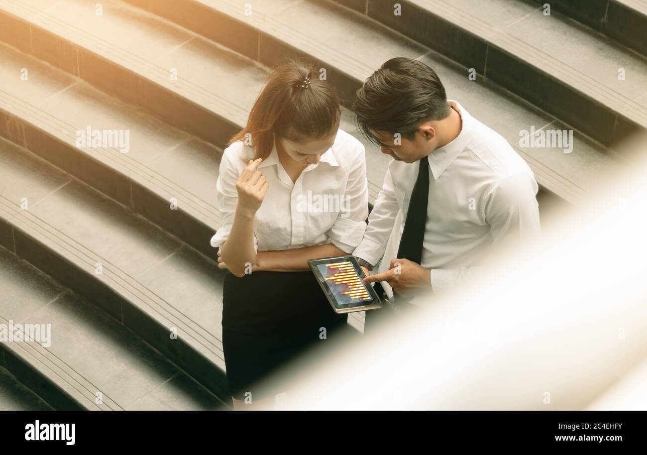 Businessman pointing chart on tablet screen and analysis together Stock ...