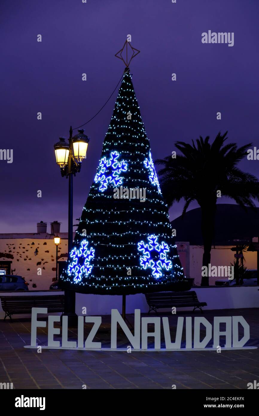 Illuminated Christmas Tree with  Feliz Navidad decorations La Olivia Fuerteventura Canary Islands Spain Stock Photo