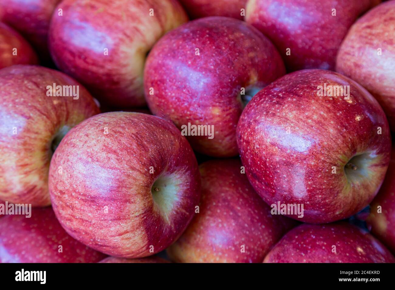 A display of red apples for sale on a market stall Stock Photo - Alamy