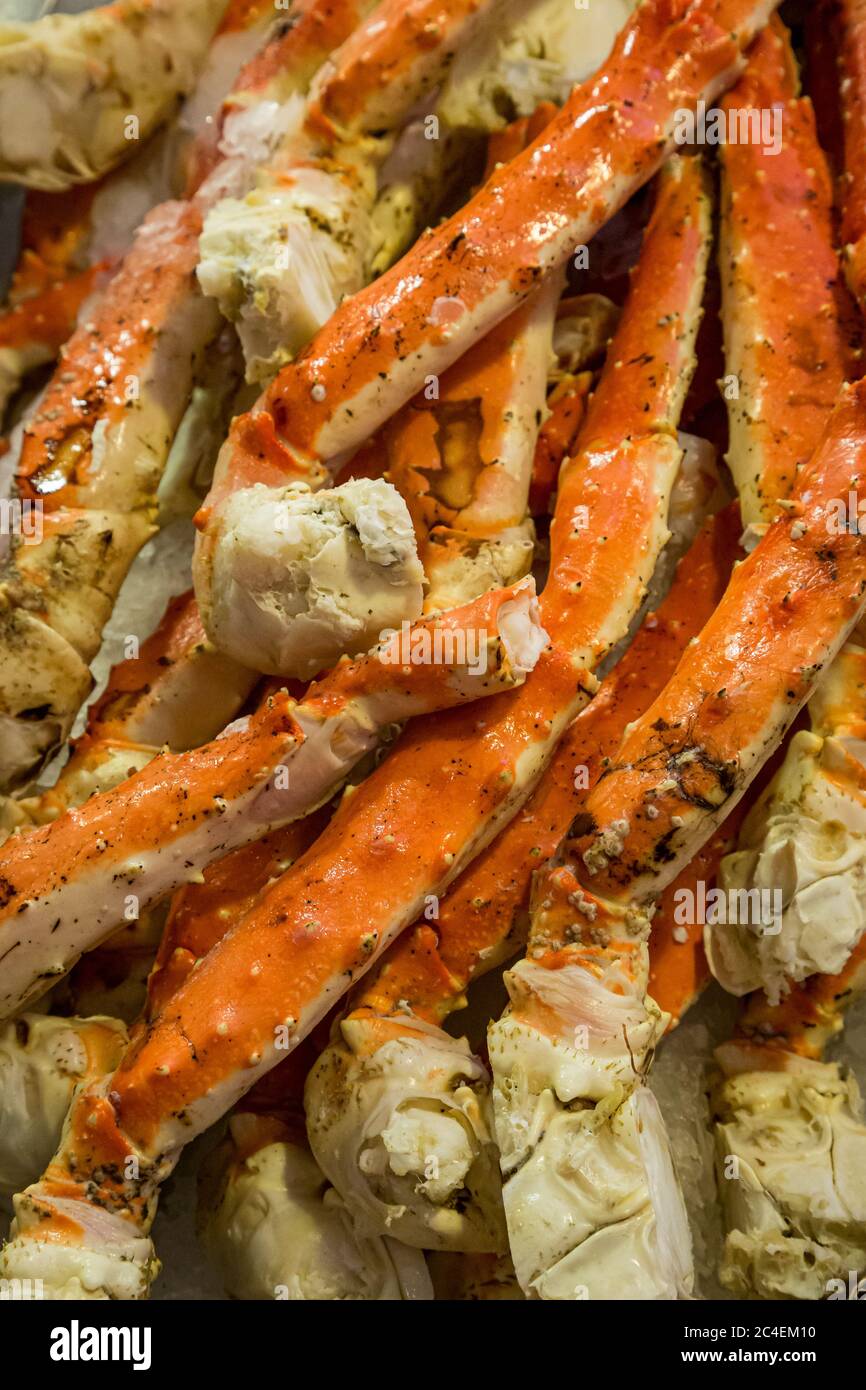 A full frame photograph of crab legs for sale on a market stall Stock