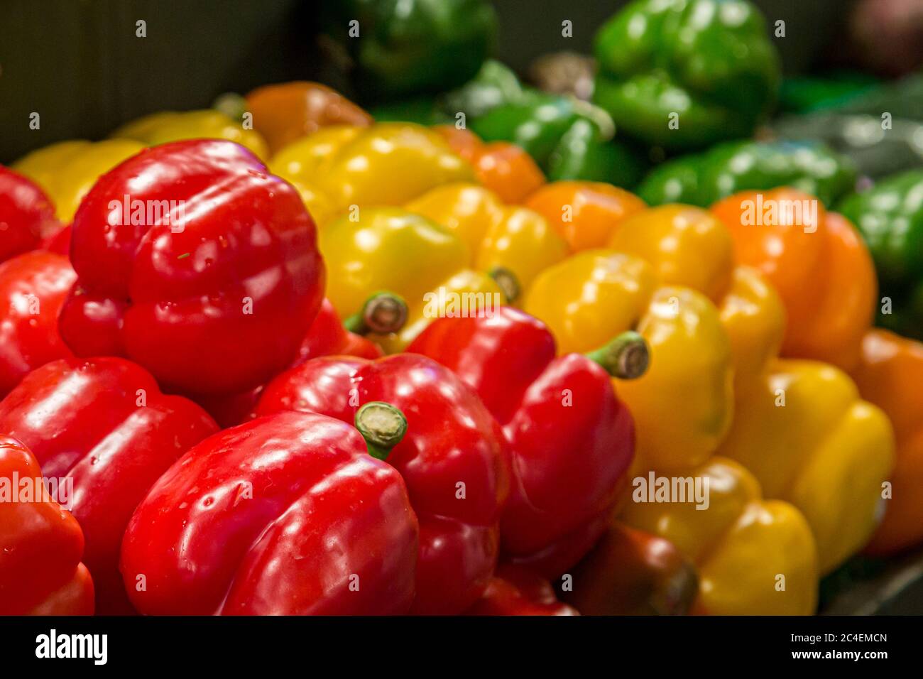 A variety of colourful bell peppers for sale on a market stall Stock ...