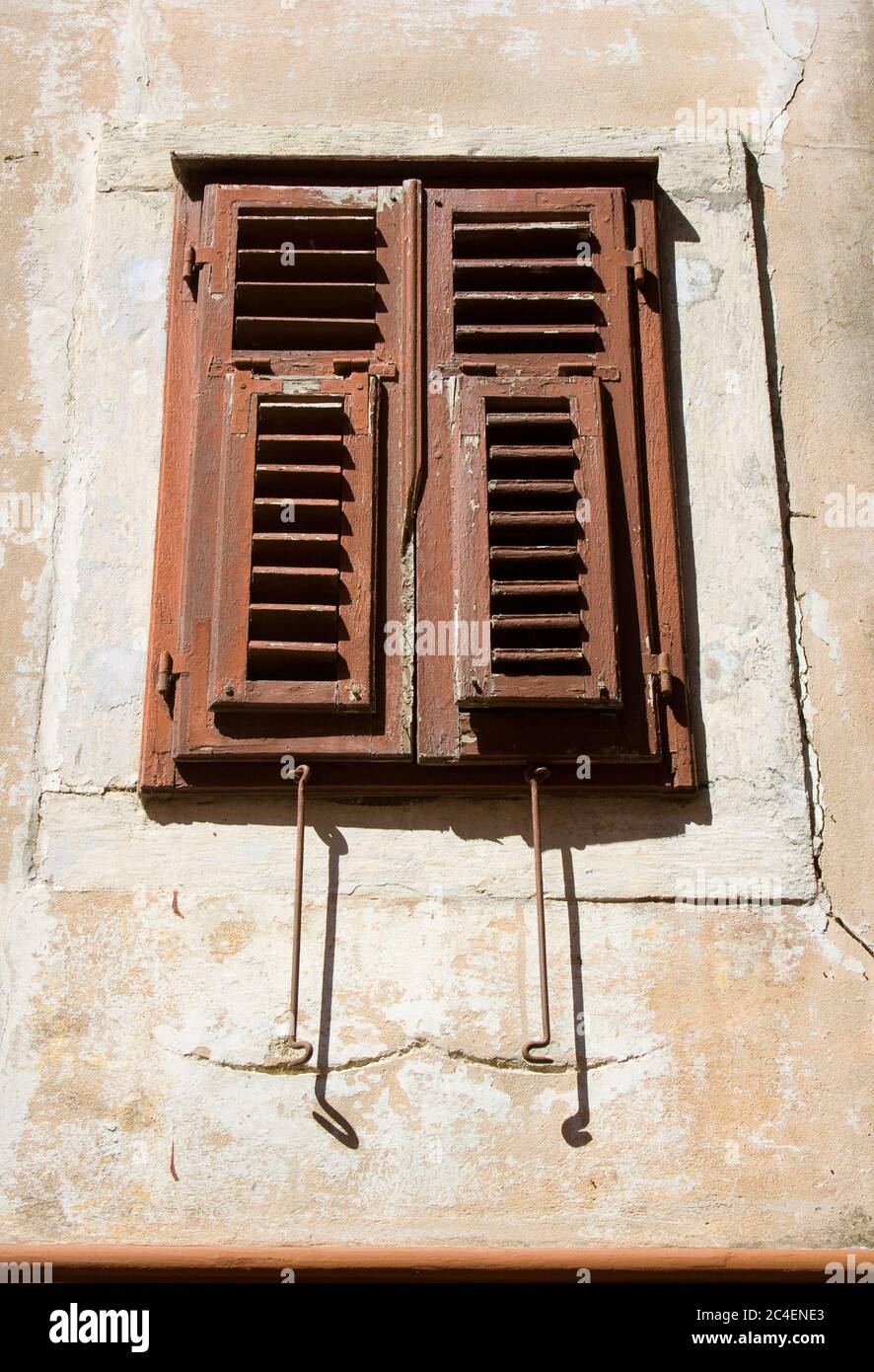 An oldstyle mediterranean window with closed panels from croatia. Stock Photo