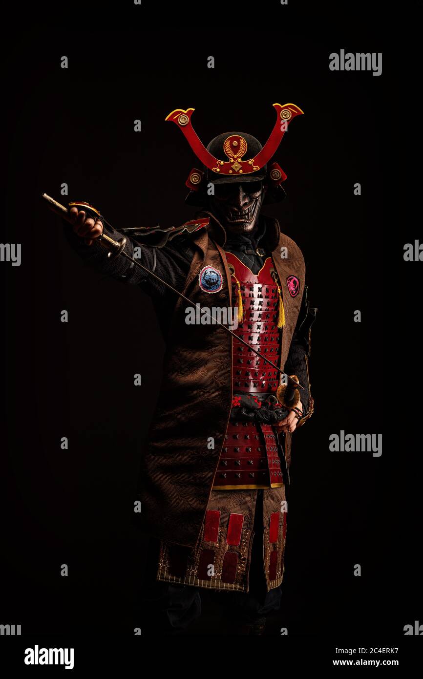 Portrait of a samurai in armor in attack position Stock Photo - Alamy