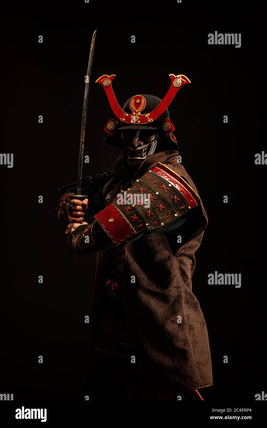 Portrait of a samurai in armor in attack position Stock Photo - Alamy