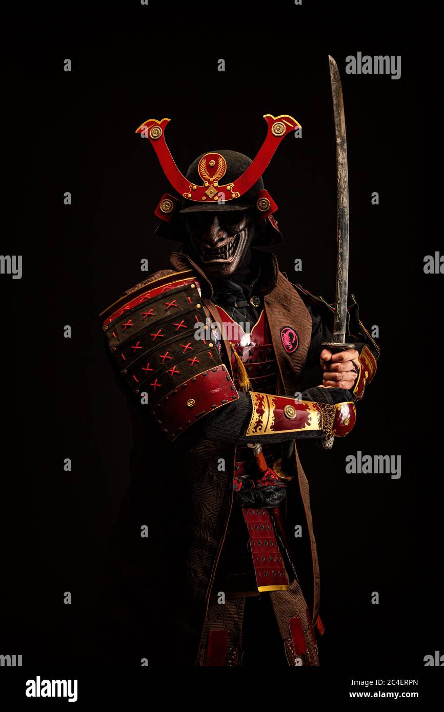 Portrait of a samurai in armor in attack position Stock Photo - Alamy