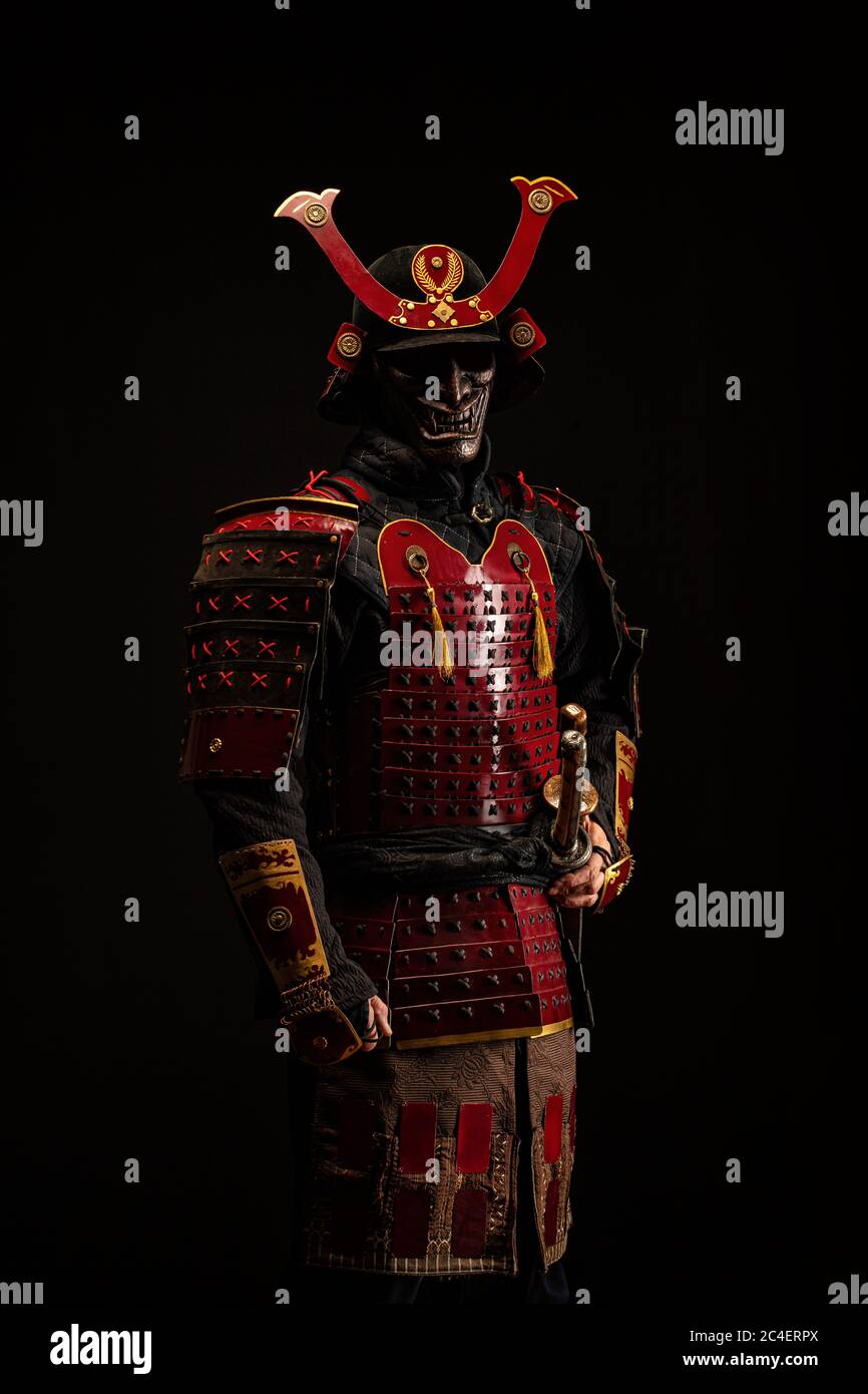 Portrait of a samurai in armor in attack position Stock Photo - Alamy