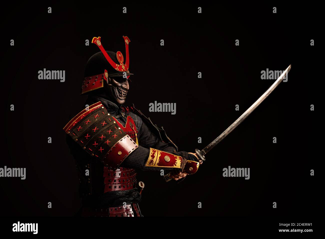 Portrait of a samurai in armor in attack position Stock Photo - Alamy