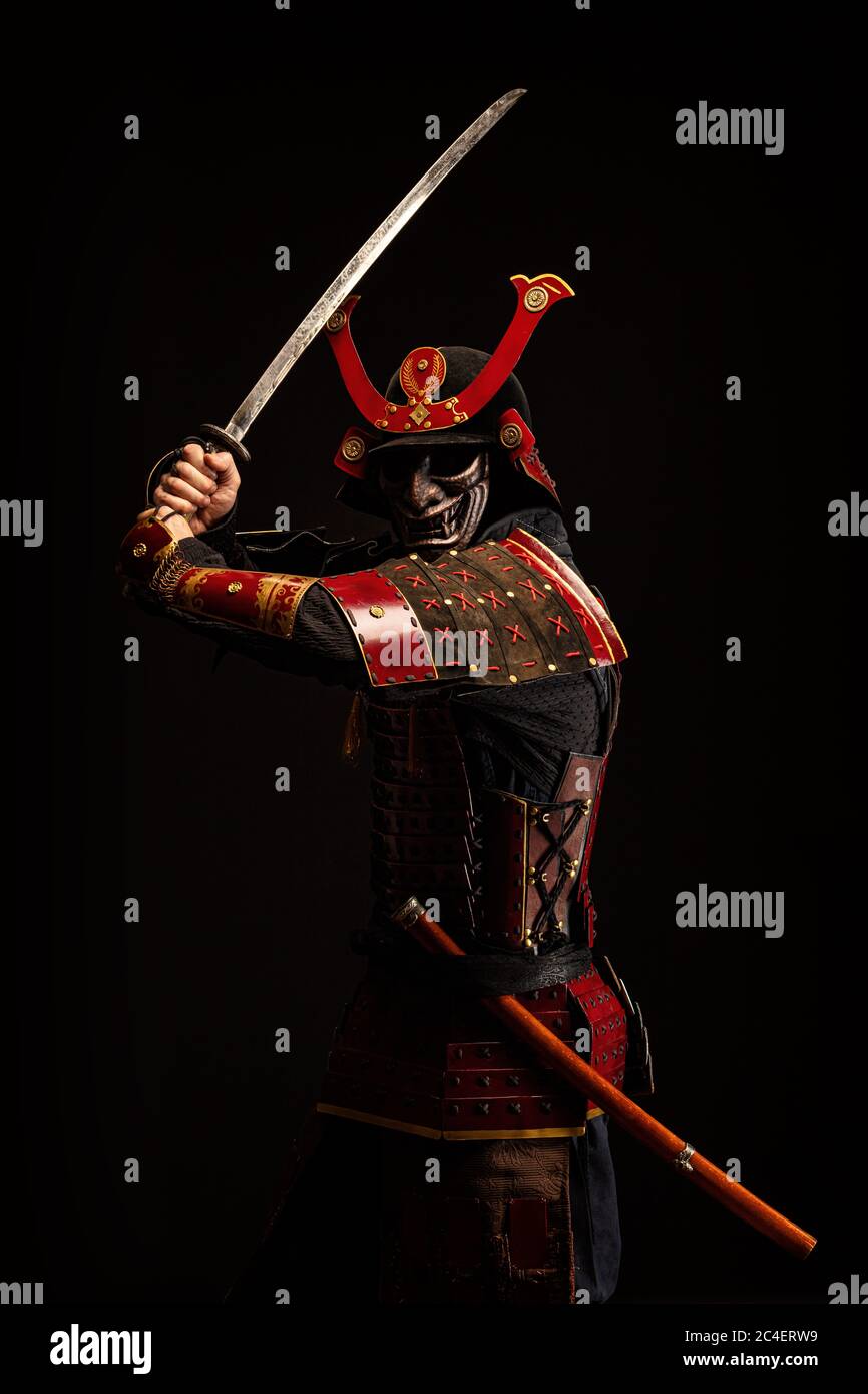 Portrait of a samurai in armor in attack position Stock Photo - Alamy