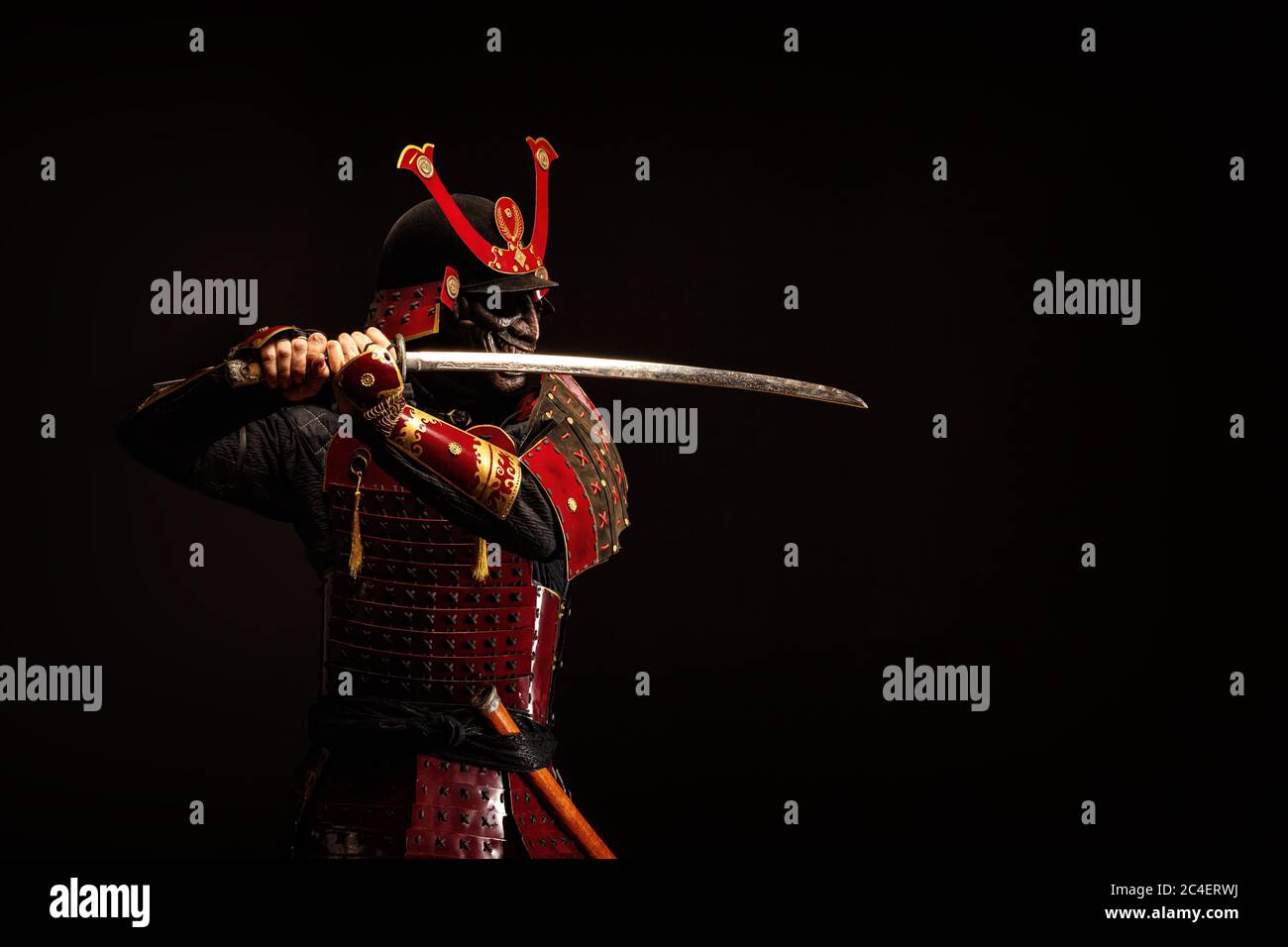 Portrait of a samurai in armor in attack position Stock Photo - Alamy