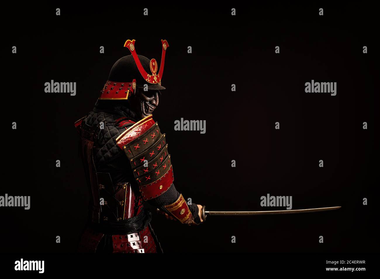 Portrait of a samurai in armor in attack position Stock Photo - Alamy