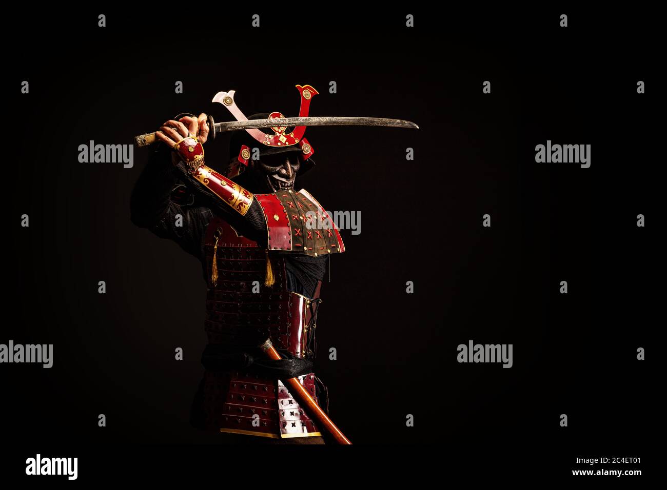 Portrait of a samurai in armor in attack position Stock Photo - Alamy