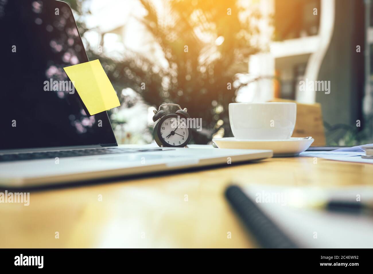 Clock and office supplies on desk office room Stock Photo Alamy