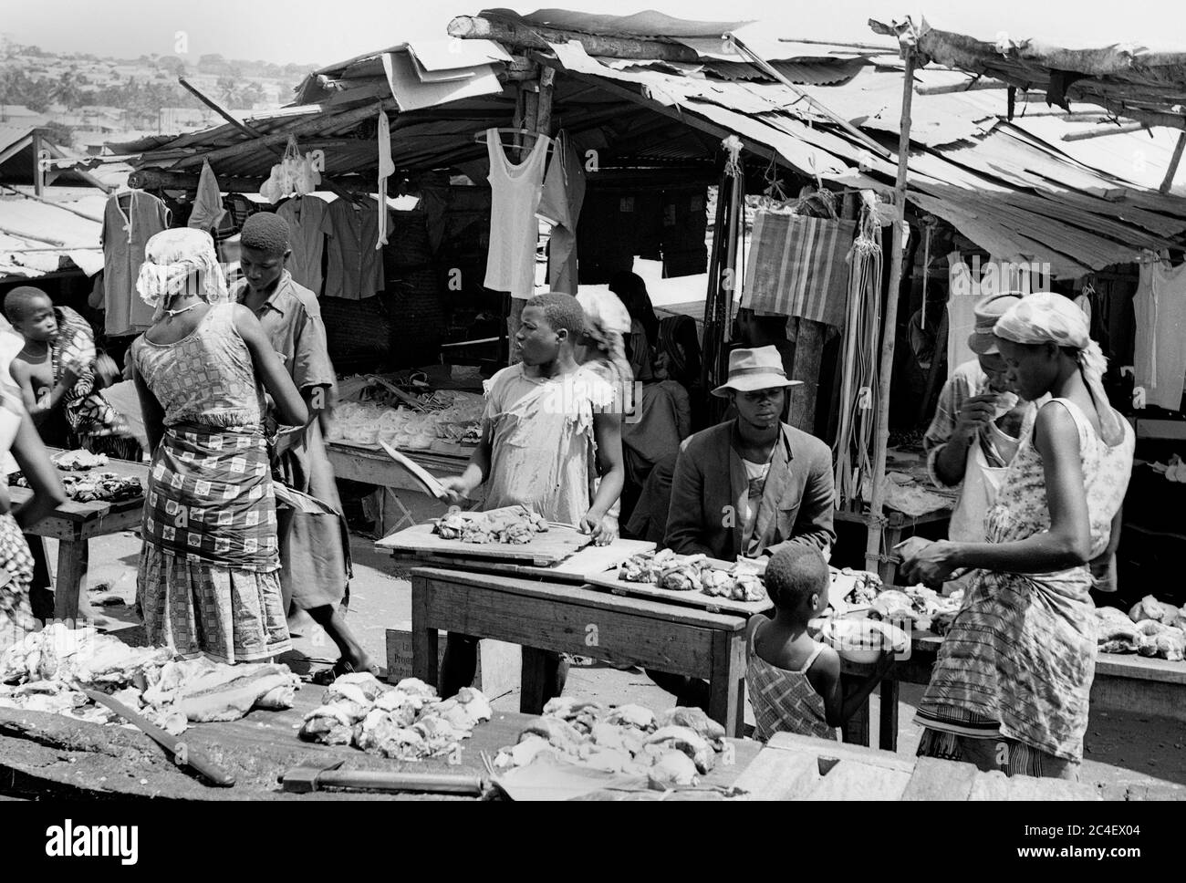 Raw meat and clothes market in Ivory Coast 1963 Cote d'Ivoire 1960s Stock Photo