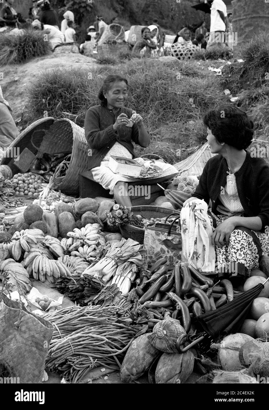 Roadside street market women selling fruit and vegetables in 1959, Baguio City, The Philippines Stock Photo