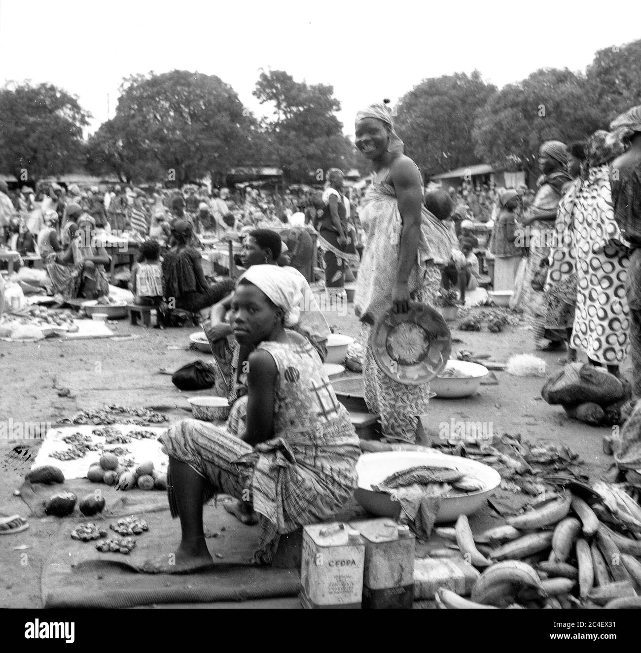 Women selling fruit and vegetables at open market in the Ivory Coast 1963 Cote d'Ivoire Ivory Coast 1960s Stock Photo