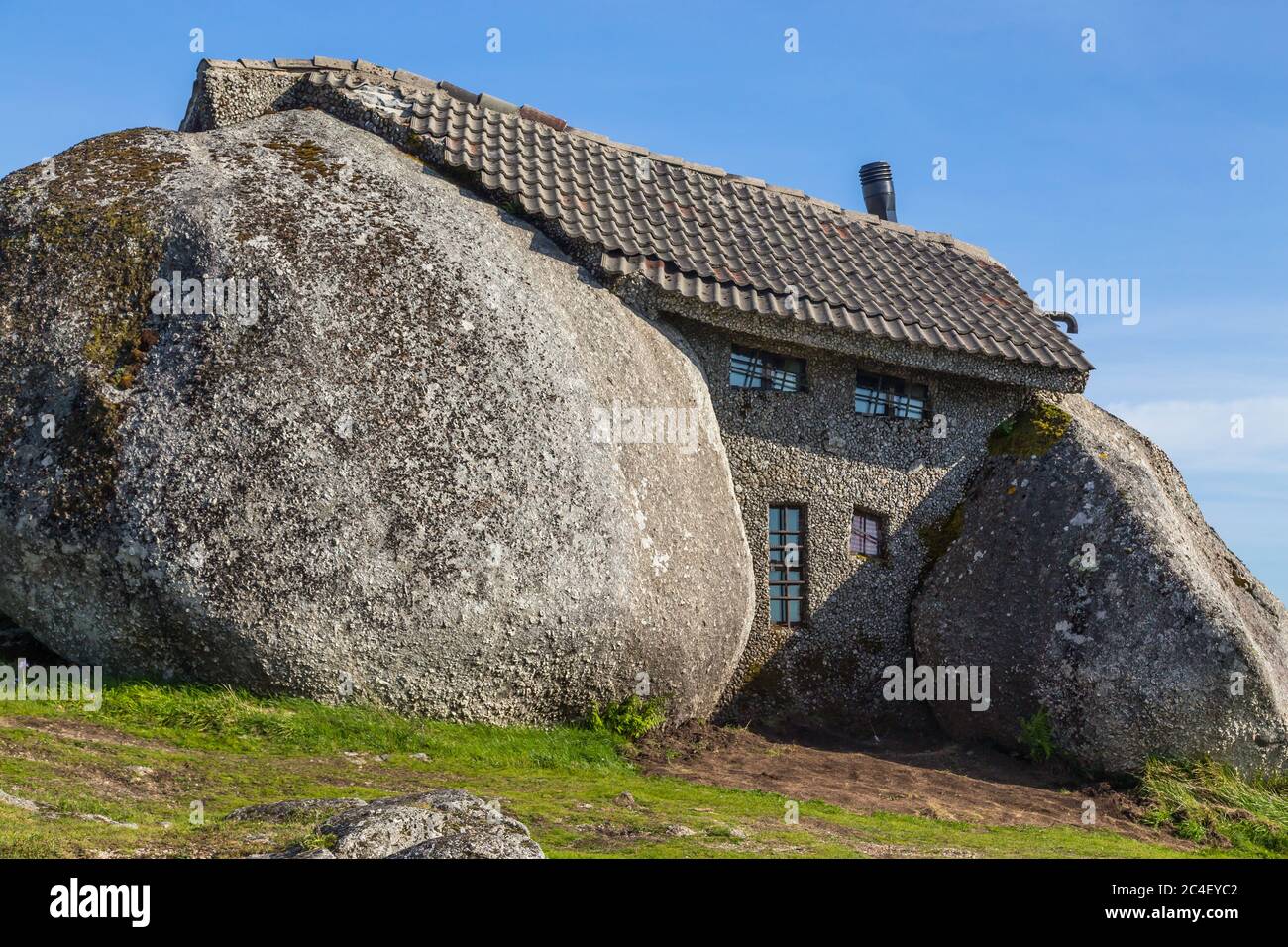 Casa do Penedo, a house built between huge rocks on top of a mountain ...
