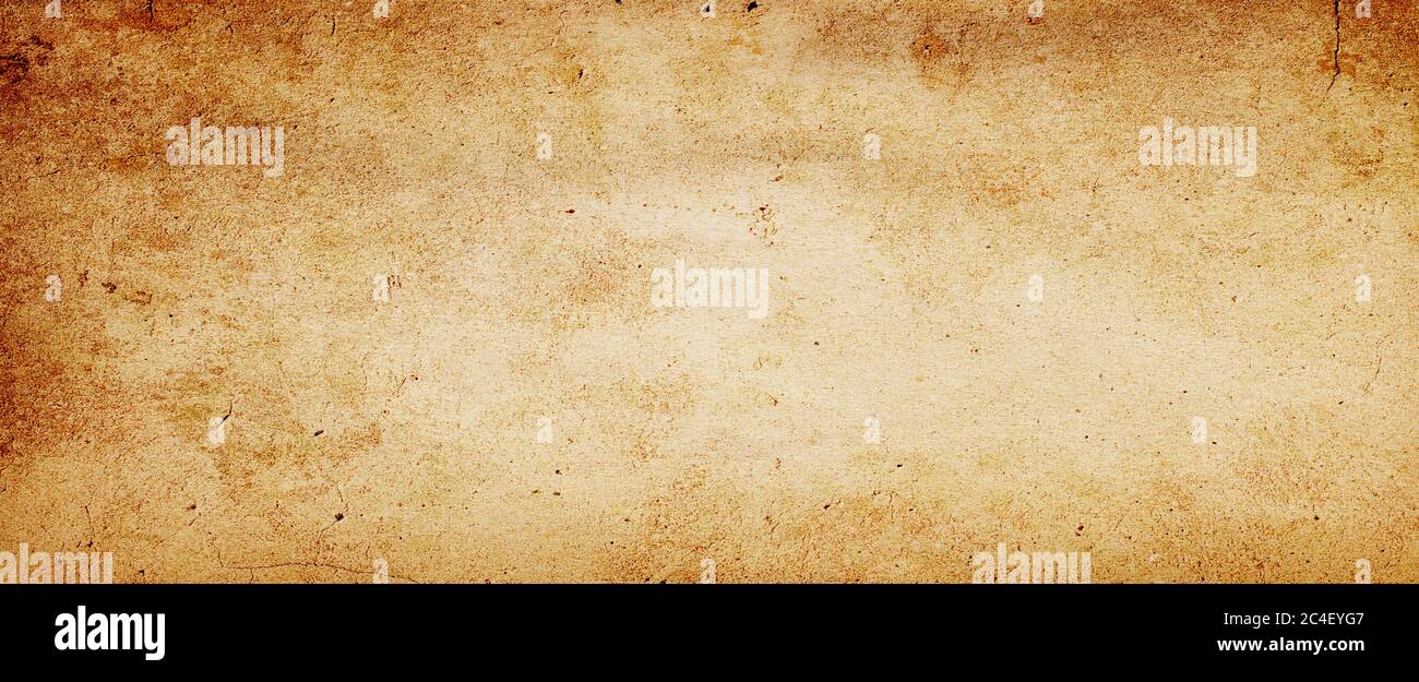 Old brown paper parchment background design with distressed vintage stains and ink spatter and white faded shabby center, elegant antique beige color Stock Photo