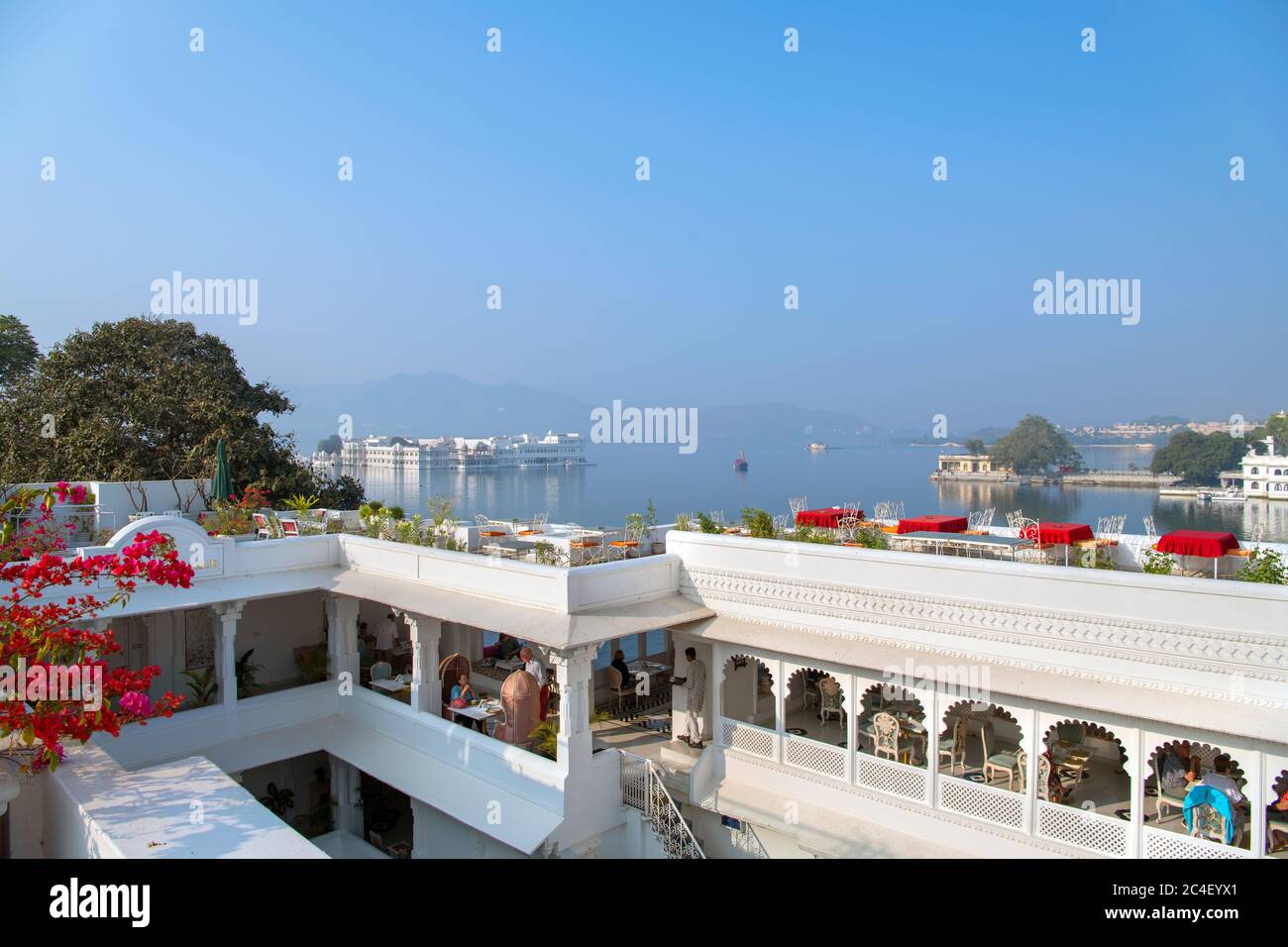 View over Lake Pichola towards the Taj Lake Palace from the Jagat Niwas Palace Hotel in the early morning, Old City, Udaipur, Rajasthan, India Stock Photo