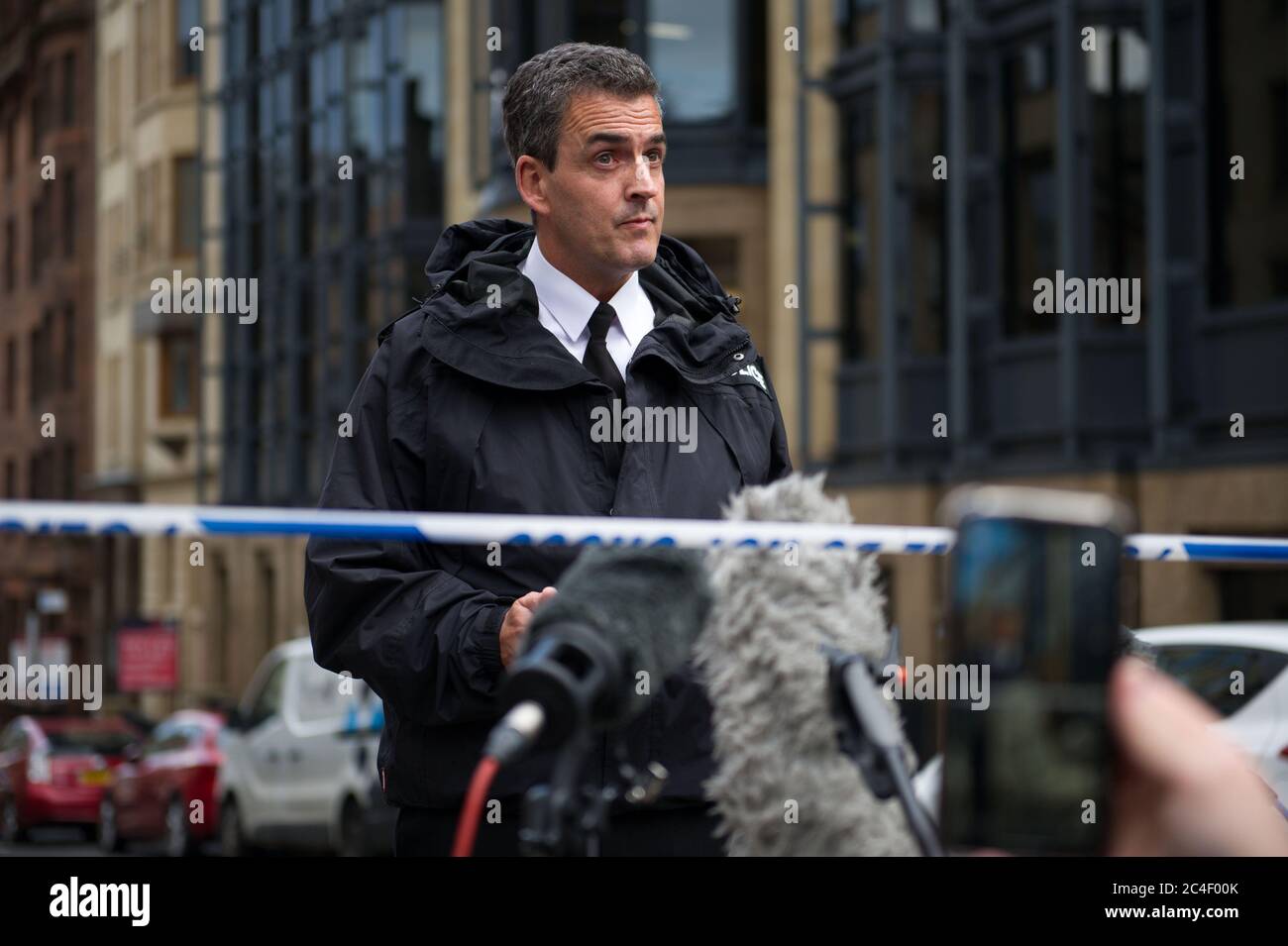 Glasgow, Scotland, UK. 26th June, 2020. Pictured: Press conference: Assistant Chief Constable (ACC) Steve Johnson addresses a packed media on a cordoned off West George Street. A major police incident has been declared in Glasgow as 6 people have been stabbed including a police officer and police shooting dead the attacker at a major incident at the Park Inn in West George Street which is hosting asylum seekers. Credit: Colin Fisher/Alamy Live News Stock Photo