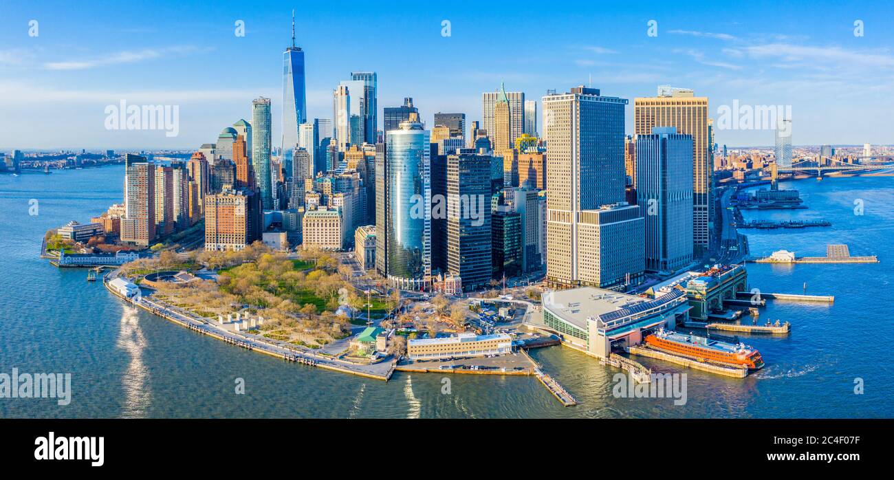 Aerial view of the Lower Manhattan skyline featuring One World Trade Center, Battery Park, Staten Island Ferry, and South Street Seaport. Stock Photo