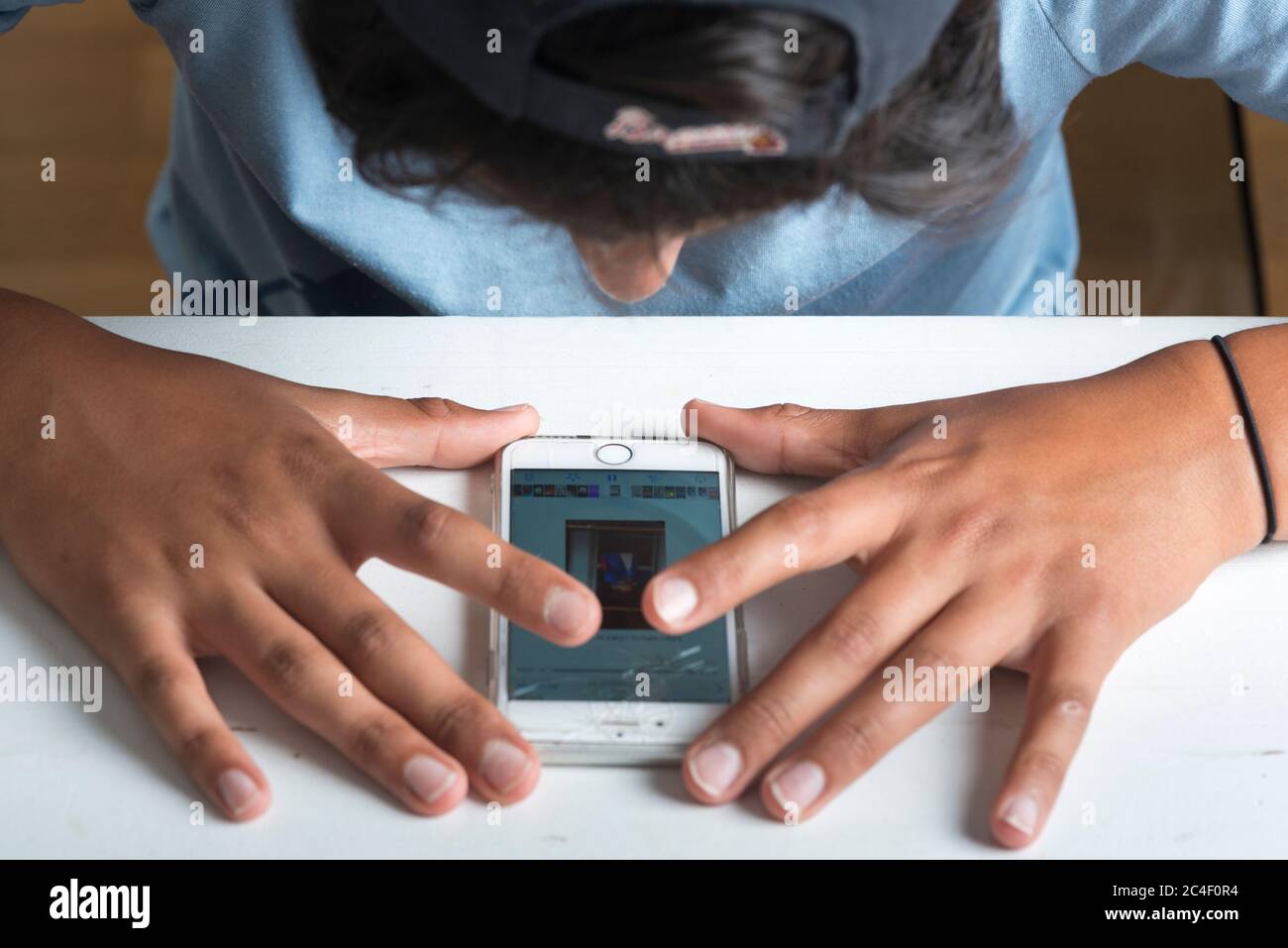 Young boy on his smart phone,UK Stock Photo