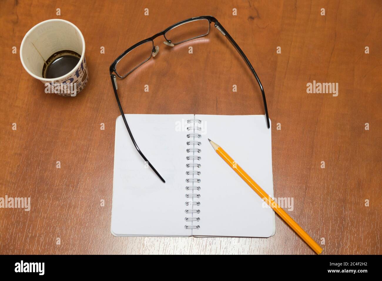 Business still life. Closeup of a clean white sheets of the notepad
