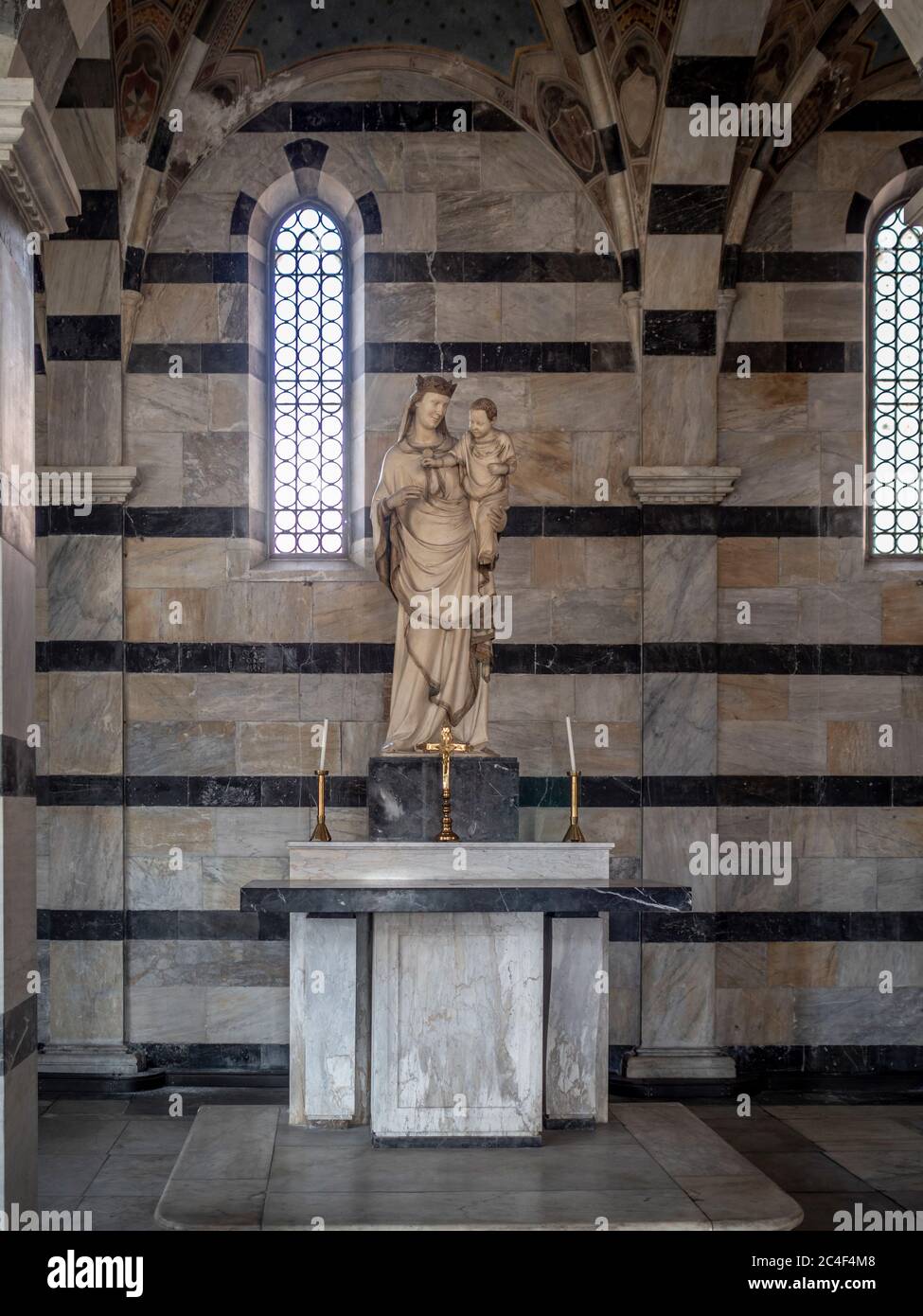 Madonna of the Rose by Andrea and Nino Pisano inside the church of Santa Maria della Spina. Pisa. Italy. Stock Photo