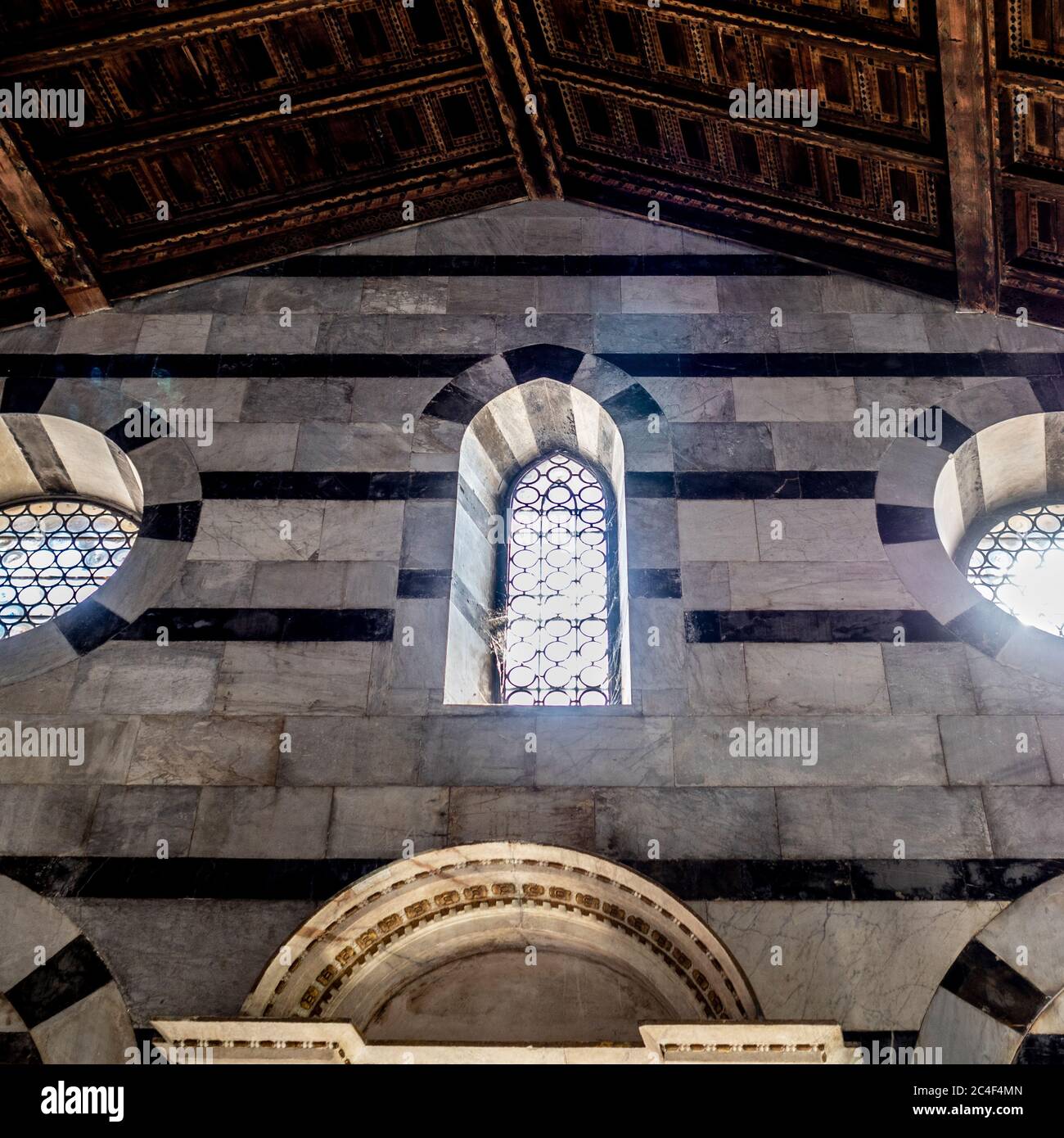 Close up view of the interior walls and the rondel leaded windows of Santa Maria della Spina. Pisa. Italy. Stock Photo