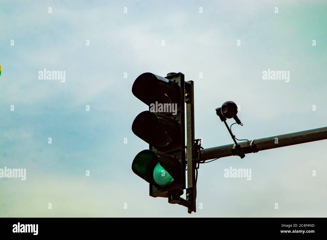 germany traffic light showing red, cloudy sky Stock Photo - Alamy
