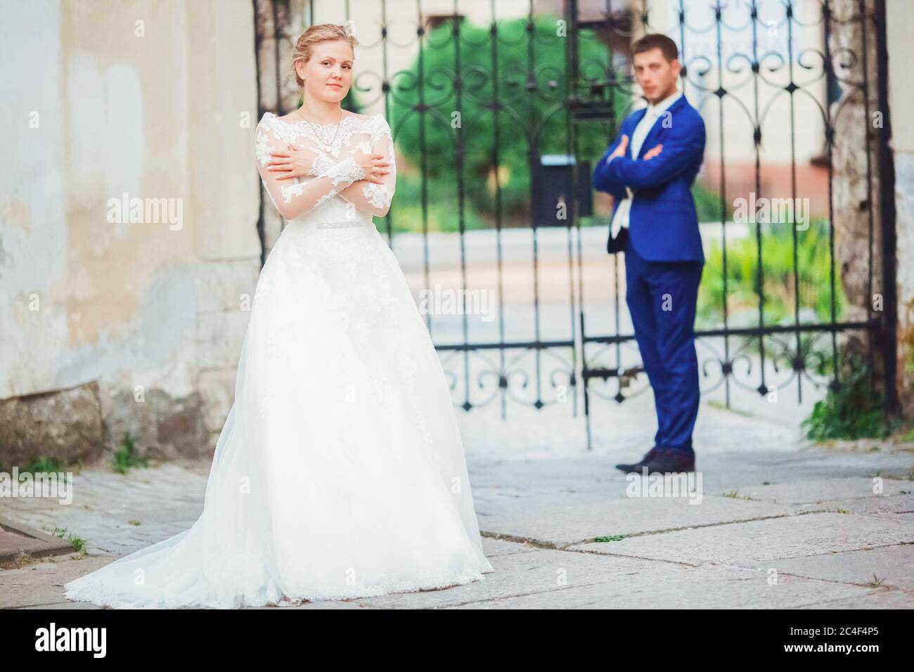bride and groom walk around the old town Stock Photo - Alamy