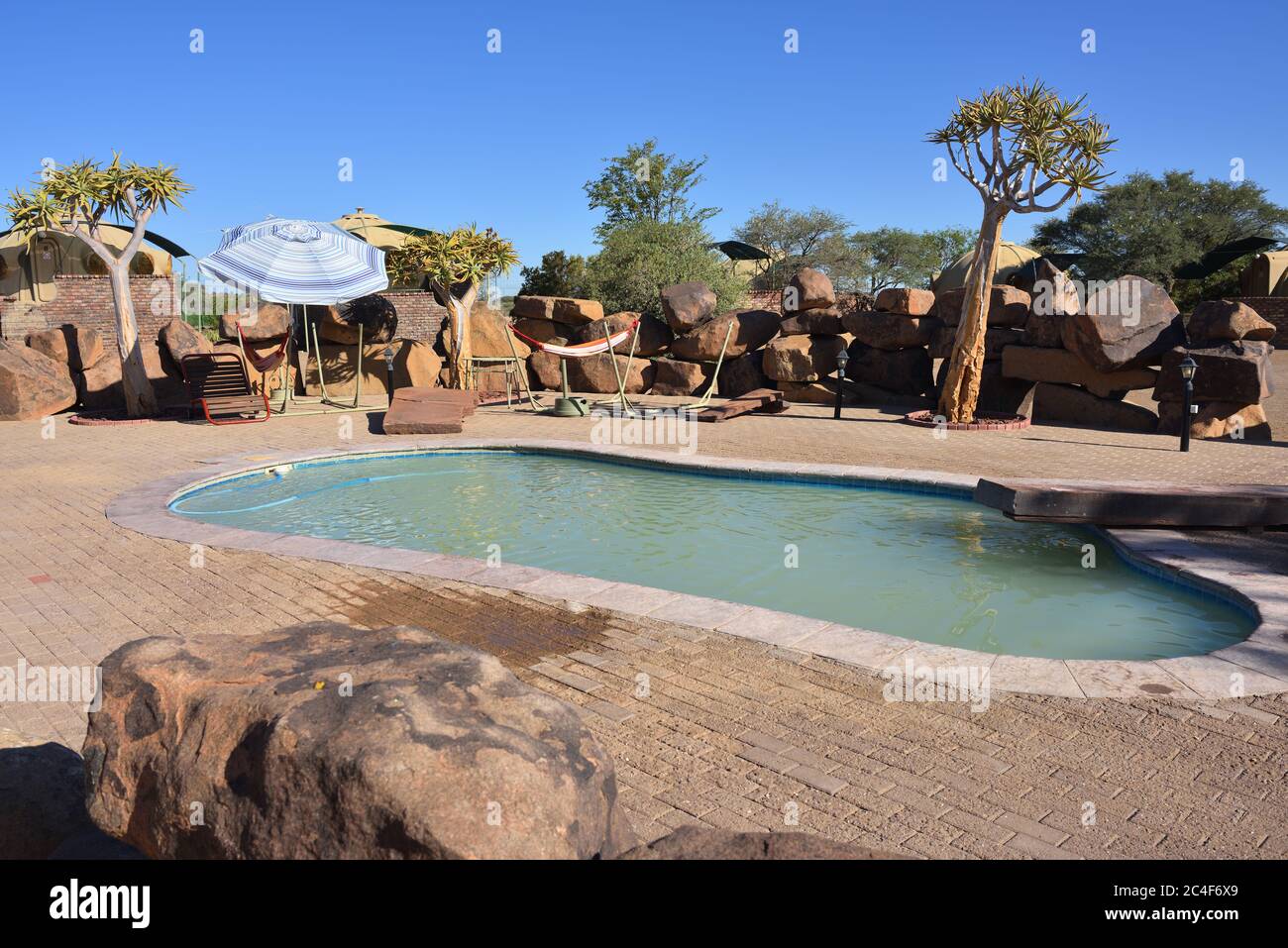 KEETMANSHOOP, NAMIBIA - JAN 25, 2016: Swimming pool in Quivertree Forest Rest Camp,  where visitors can explore the ancient and famous Quivertree Fore Stock Photo
